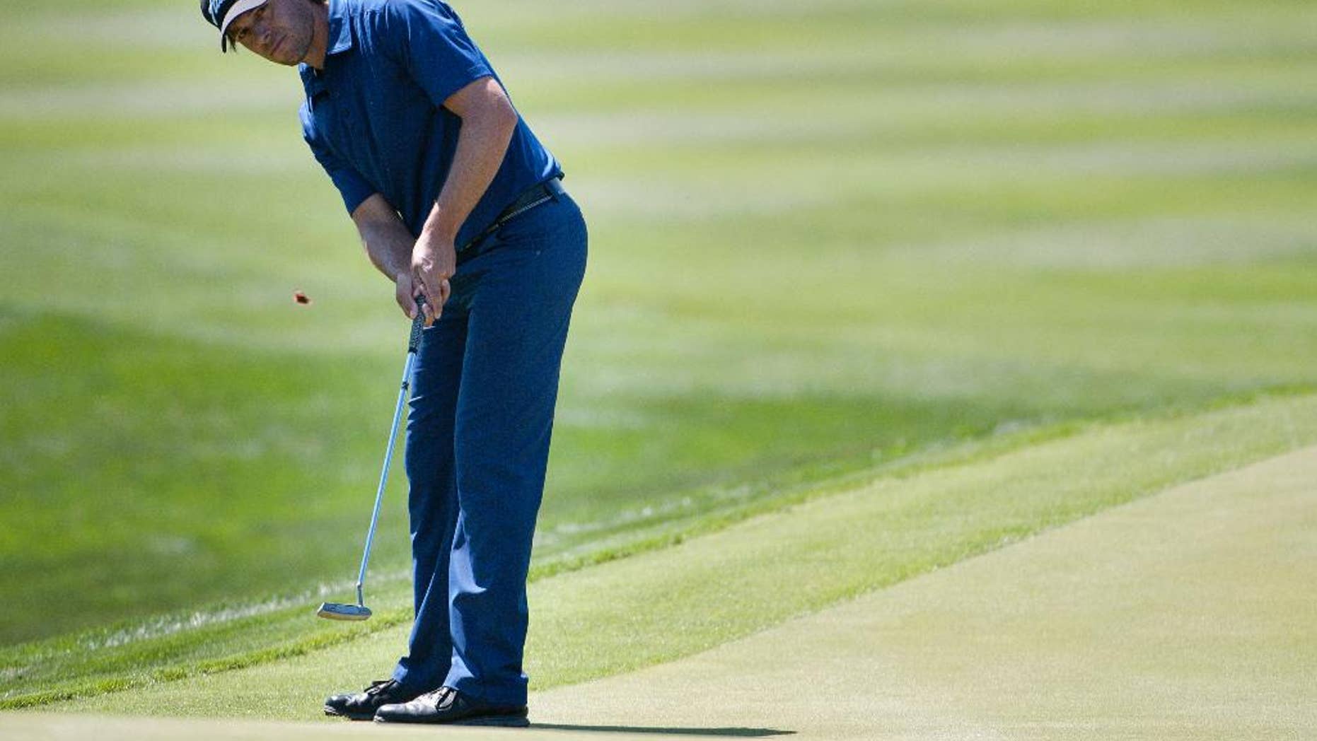 Aaron Baddeley, of Australia, putts on the ninth green during the second round of the Valero Texas Open golf tournament, Friday, March 27, 2015, in San Antonio. (AP Photo/Darren Abate)