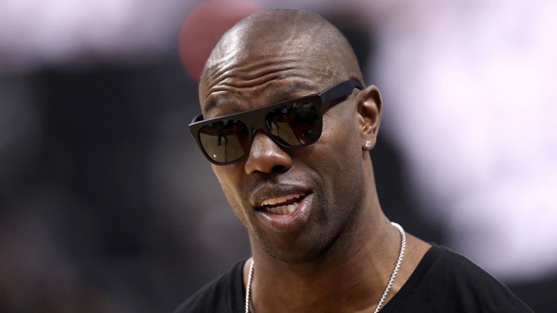 TORONTO, ON - MAY 23: Former NFL player Terrell Owens attends game four of the Eastern Conference Finals between the Cleveland Cavaliers and the Toronto Raptors during the 2016 NBA Playoffs at the Air Canada Centre on May 23, 2016 in Toronto, Ontario, Canada. NOTE TO USER: User expressly acknowledges and agrees that, by downloading and or using this photograph, User is consenting to the terms and conditions of the Getty Images License Agreement. (Photo by Tom Szczerbowski/Getty Images)