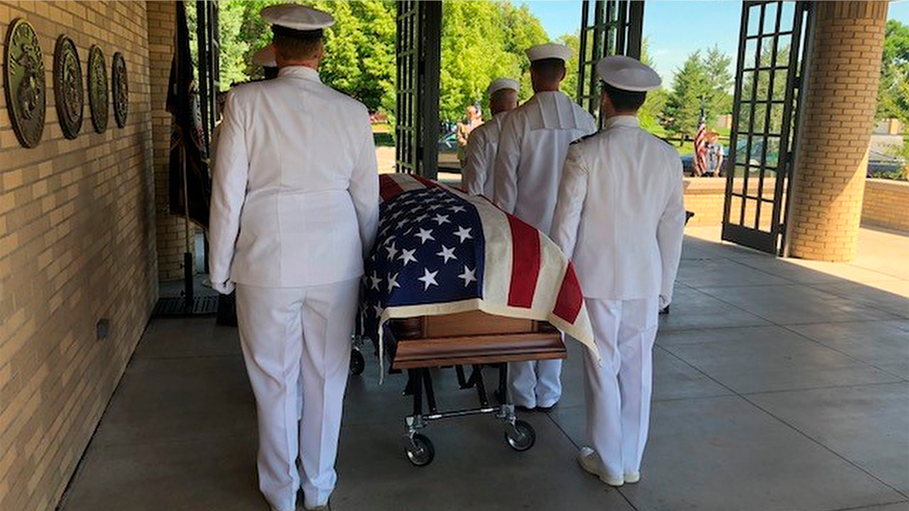 U.S. Navy pallbearers carried the remains of Wallace Eakes, a sailor who was killed in the Japanese attack on Pearl Harbor, who was reburied with full military honors at Fort Logan National Cemetery in Denver, Colo. on Thursday.