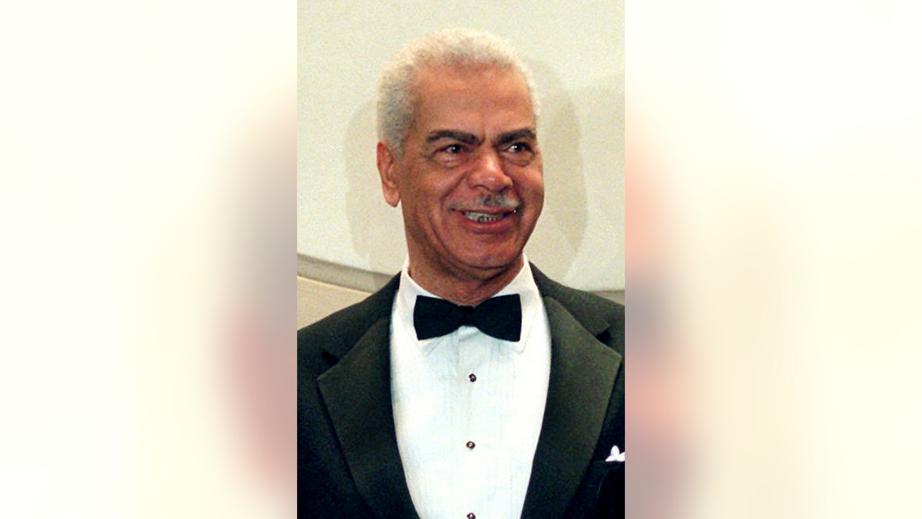 FILE - In this Feb. 3, 1997, file photo, Earle Hyman poses before an induction to the Theater Hall of Fame at the Gershwin Theatre in New York. Hyman, a veteran actor of stage and screen who was widely known for playing Russell Huxtable on "The Cosby Show," has died. Strohl, a representative for The Actors Fund, says that Hyman died Friday, Nov. 17, 2017, at the Lillian Booth Actors Home in Englewood, New Jersey. He was 91. (AP Photo/Ron Frehm, File)
