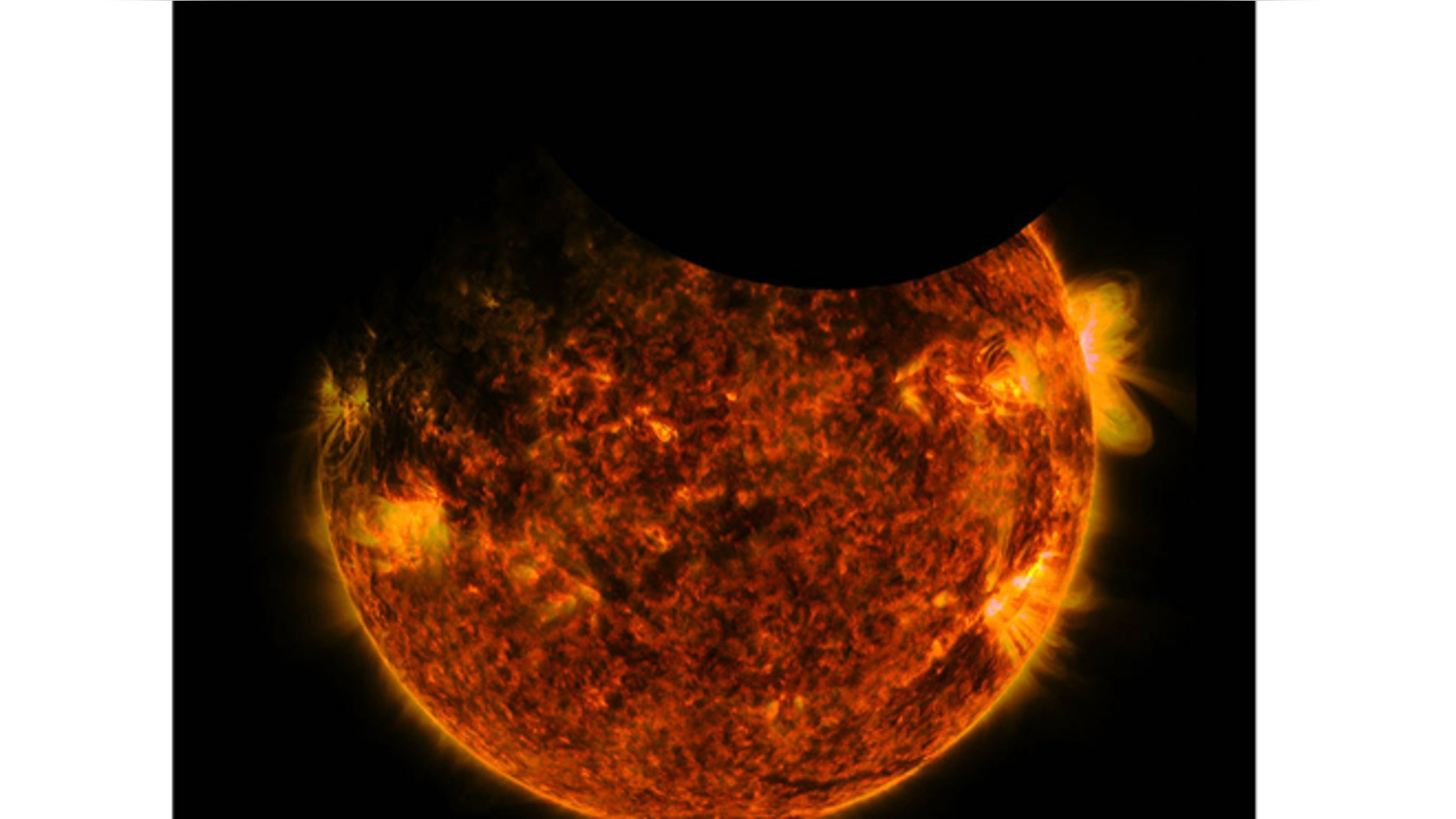 Early Friday, NASA’s Solar Dynamics Observatory caught both Earth and the moon passing in front of the sun. (NASA)