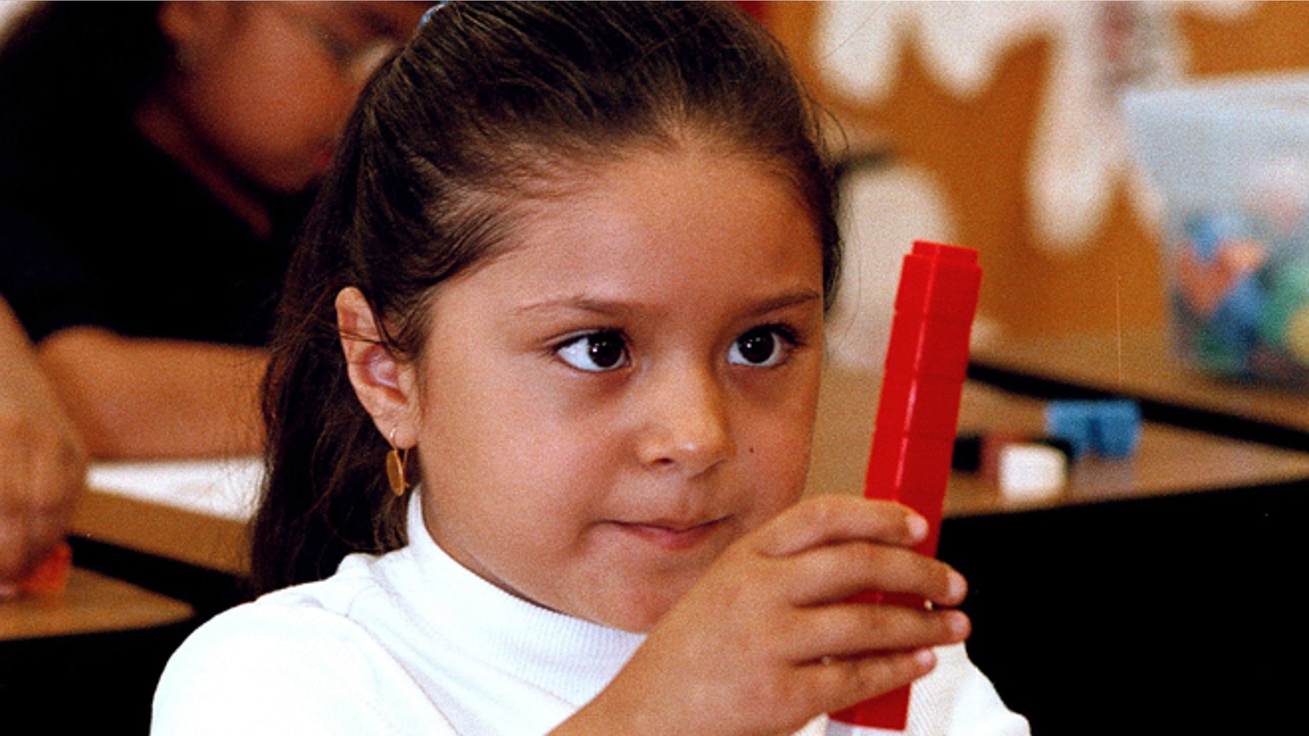 TYLER,TX - SEPTEMBER 11: Seven-year-old Dulce Oliva constructs a stack of blocks during a math lesson in English at Birdwell Elementary School September 11, 2003 in Tyler, Texas. Oliva is one of the 60 percent of Hispanic students among a student body of 600 at the east Texas school. (Photo by Mario Villafuerte/Getty Images)