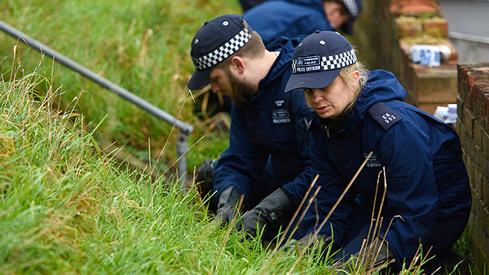 Police search the home of British actress Sian Blake in Erith, England.