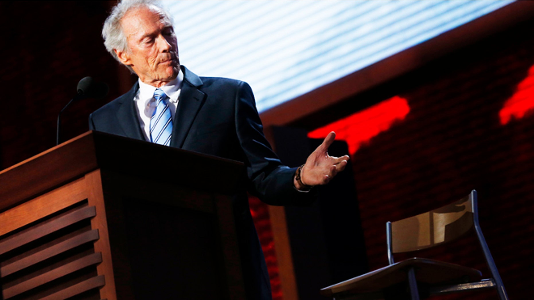 Actor Clint Eastwood addresses an empty chair and questions it as if it is U.S. President Obama, as he endorses Republican presidential nominee Mitt Romney during the final session of the Republican National Convention in Tampa, Florida, August 30, 2012. REUTERS/Eric Thayer (UNITED STATES - Tags: POLITICS ELECTIONS TPX IMAGES OF THE DAY) - RTR37B1D