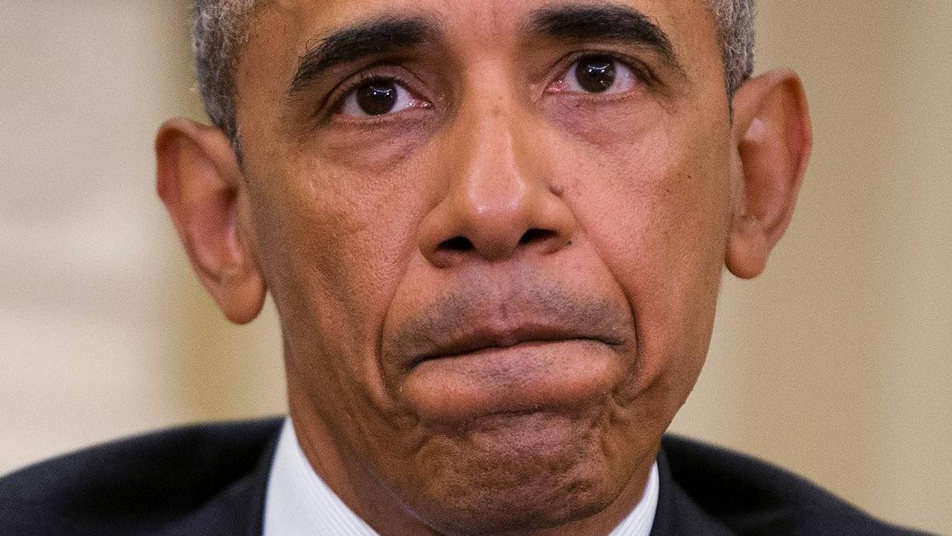 President Barack Obama pauses while speaking to members of the media in the Oval Office of the White House in Washington, Monday, June 13, 2016, after getting briefed on the investigation of a shooting at a nightclub in Orlando by FBI Director James Comey, Homeland Security Secretary Jeh Johnson, and other officials. (AP Photo/Pablo Martinez Monsivais)