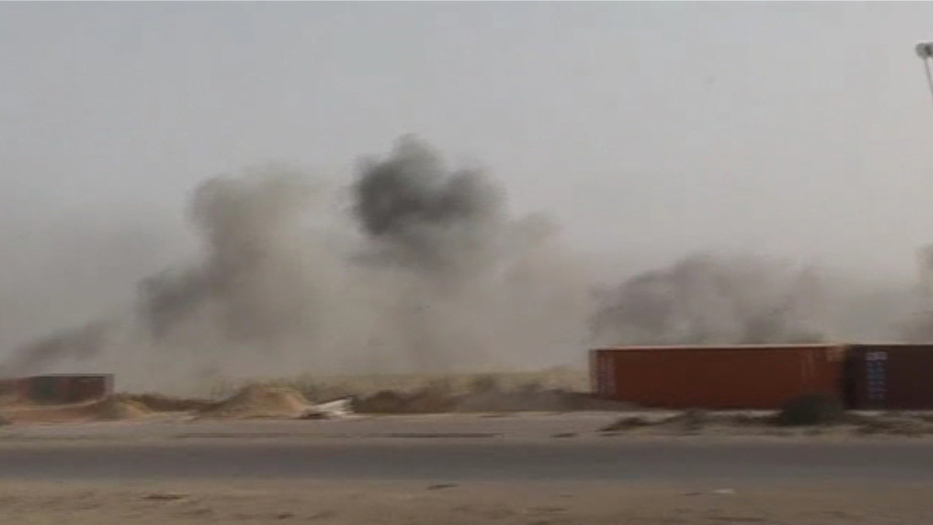 May 1: In this image taken from Associated Press Television News footage, smoke rises from the dock area of Misrata, Libya, after Libyan government forces fired more than two dozen Grad rockets and mortars towards the area. Misrata, which is the main rebel-held city in the west, has emerged as a key prize as the two sides have been locked in a stalemate with Qaddafi holding sway over the western half of the country and the rebels dominating the east. (AP/APTN)