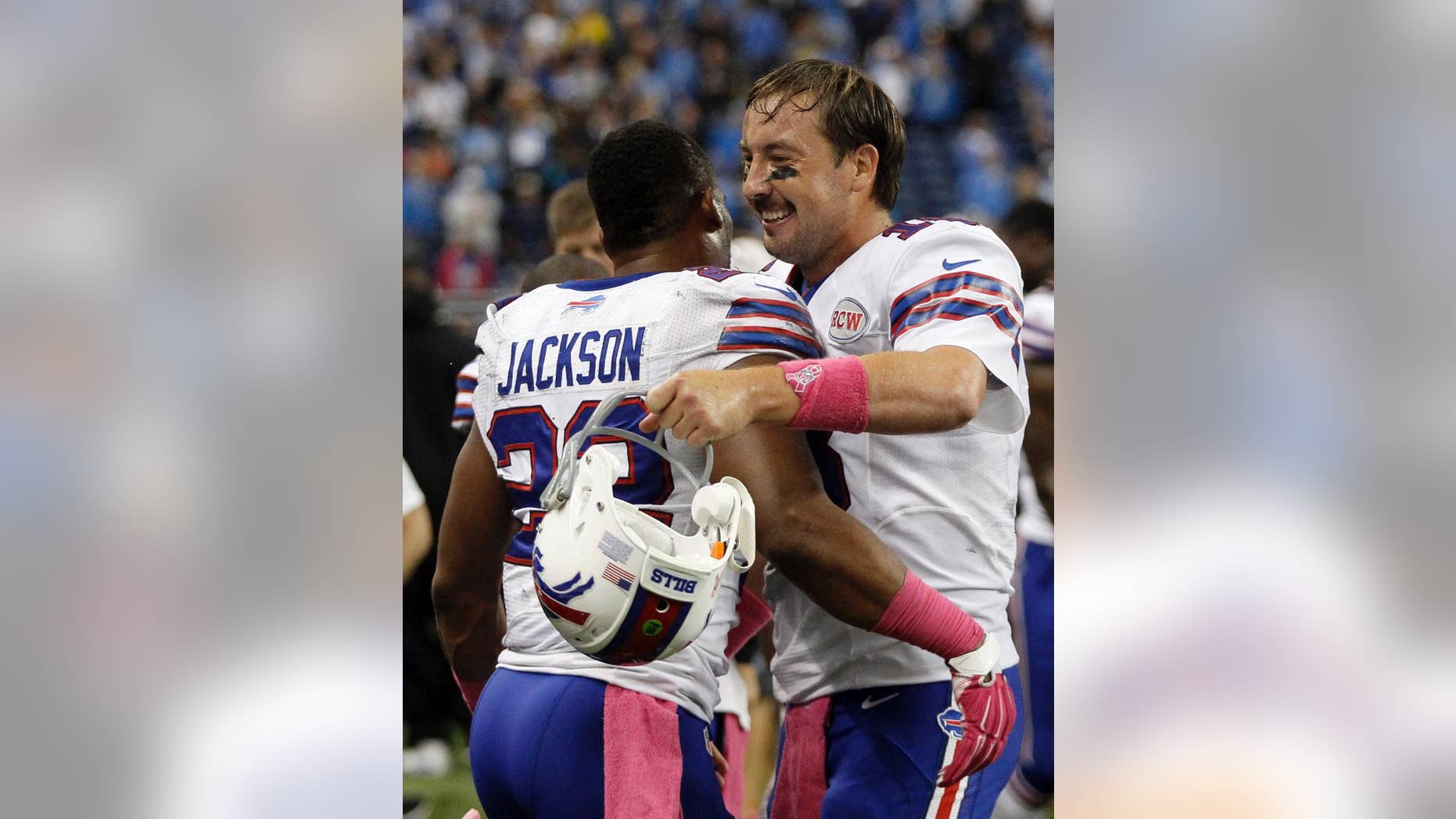 Buffalo Bills quarterback Kyle Orton, right, hugs teammate Fred Jackson after they defeated the Detroit Lions 17-14 in an NFL football game Sunday, Oct. 5, 2014, in Detroit. (AP Photo/Duane Burleson)