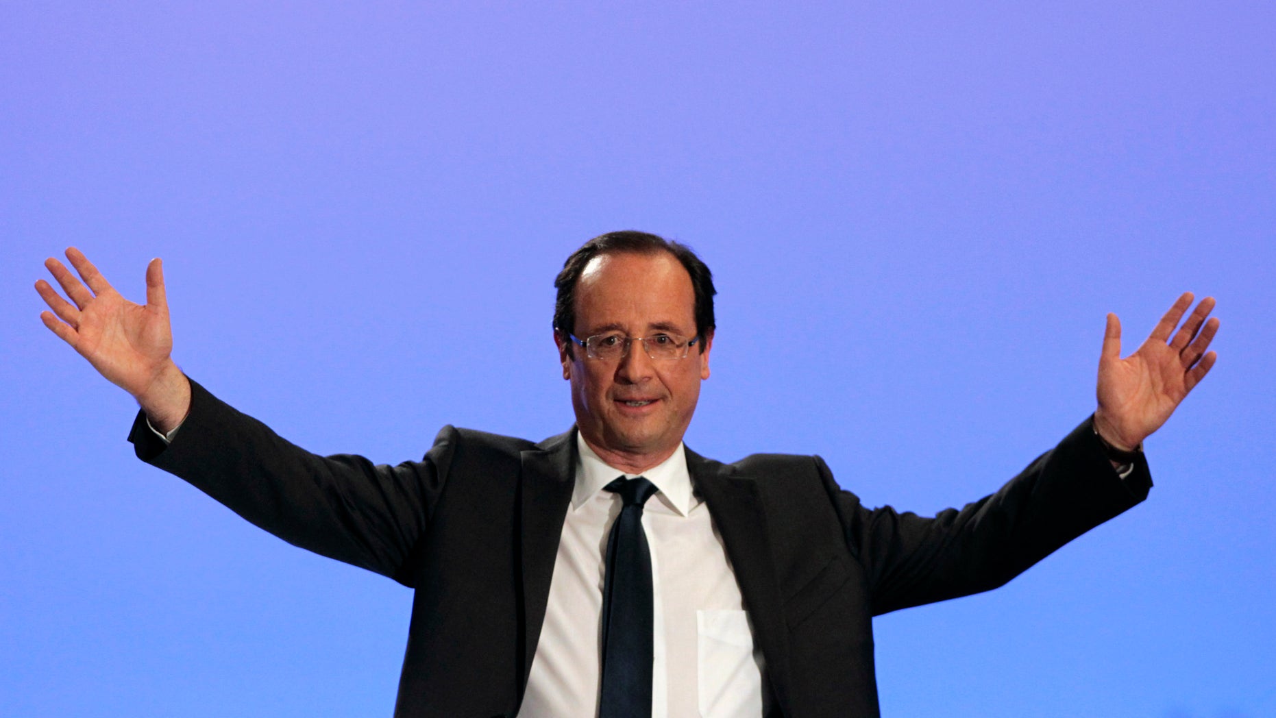 April 22: Socialist Party candidate for the presidential election Francois Hollande waves to supporters after the presidential election first round, in Tulle, central France.