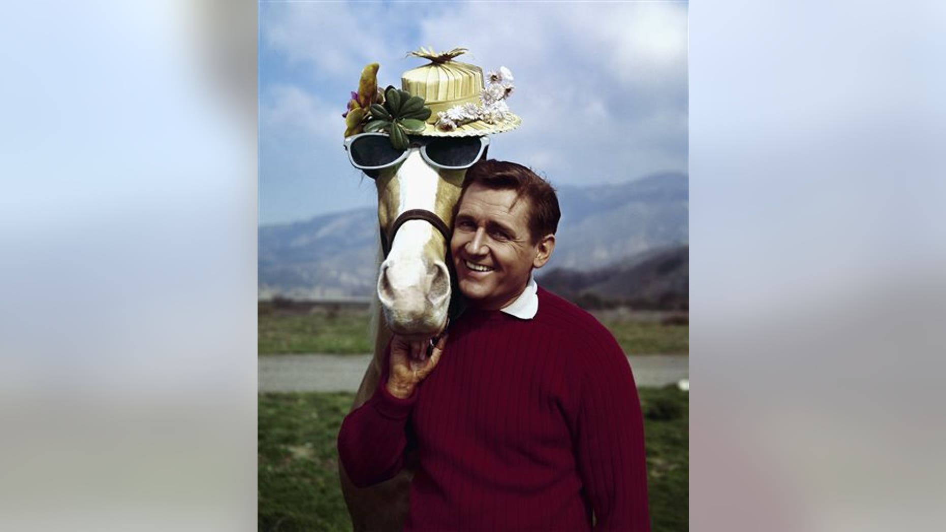 FILE - In this March 22, 1962 file photo, actor Alan Young poses with the "Mister Ed," horse. Young died Thursday, May 19, 2016. He was 96. (AP Photo, File)
