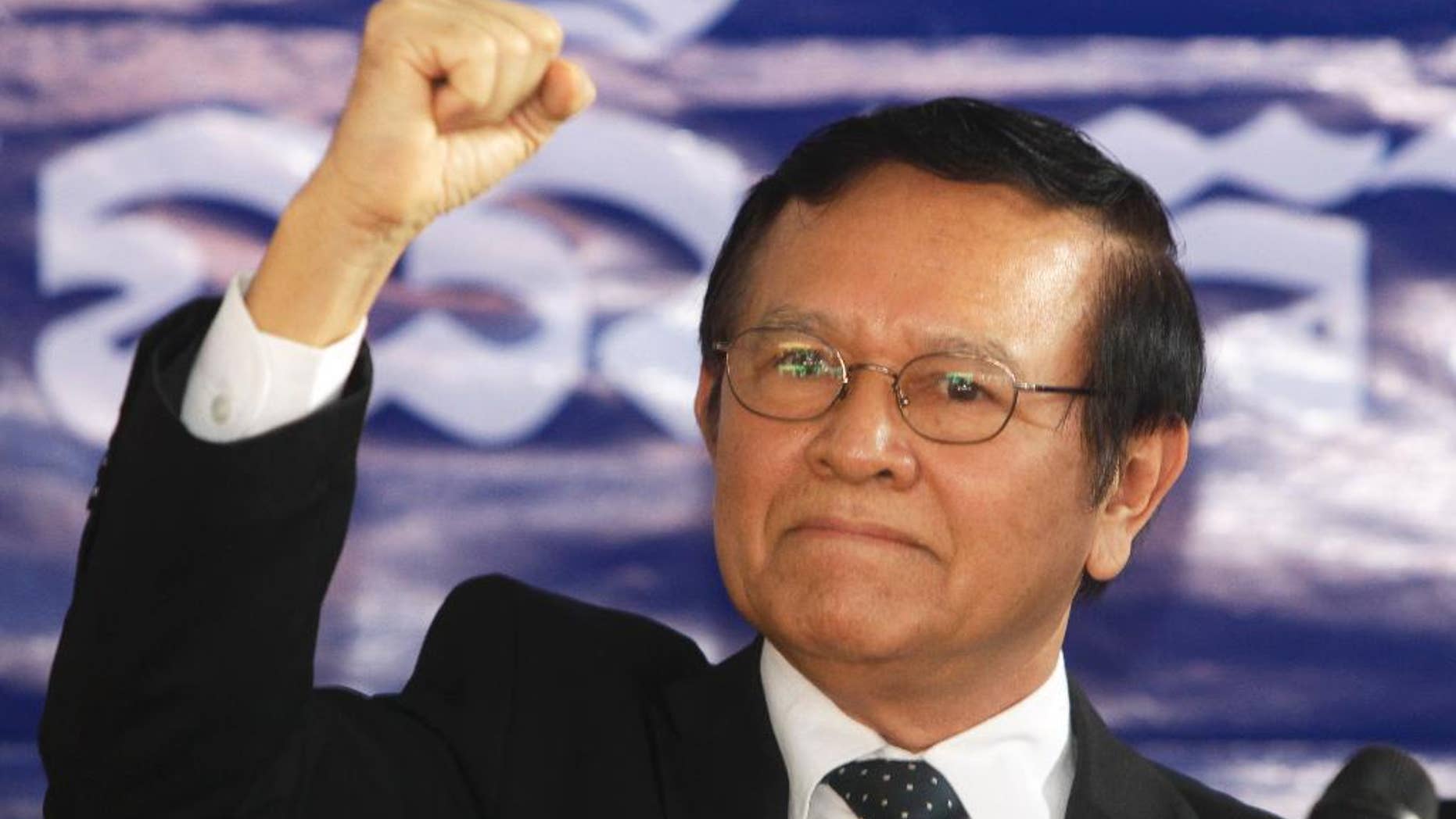 FILE - In This Friday, Sept. 9, 2016, file photo, opposition Cambodia National Rescue Party Deputy President Kem Sokha gestures during a speech at the party headquarters in Phnom Penh, Cambodia. Cambodia's King Norodom Sihamoni’s pardon Friday of Kem Sokha allows him to avoid five months in prison for failing to answer a summons in a case involving his alleged mistress. (AP Photo/Heng Sinith, File)