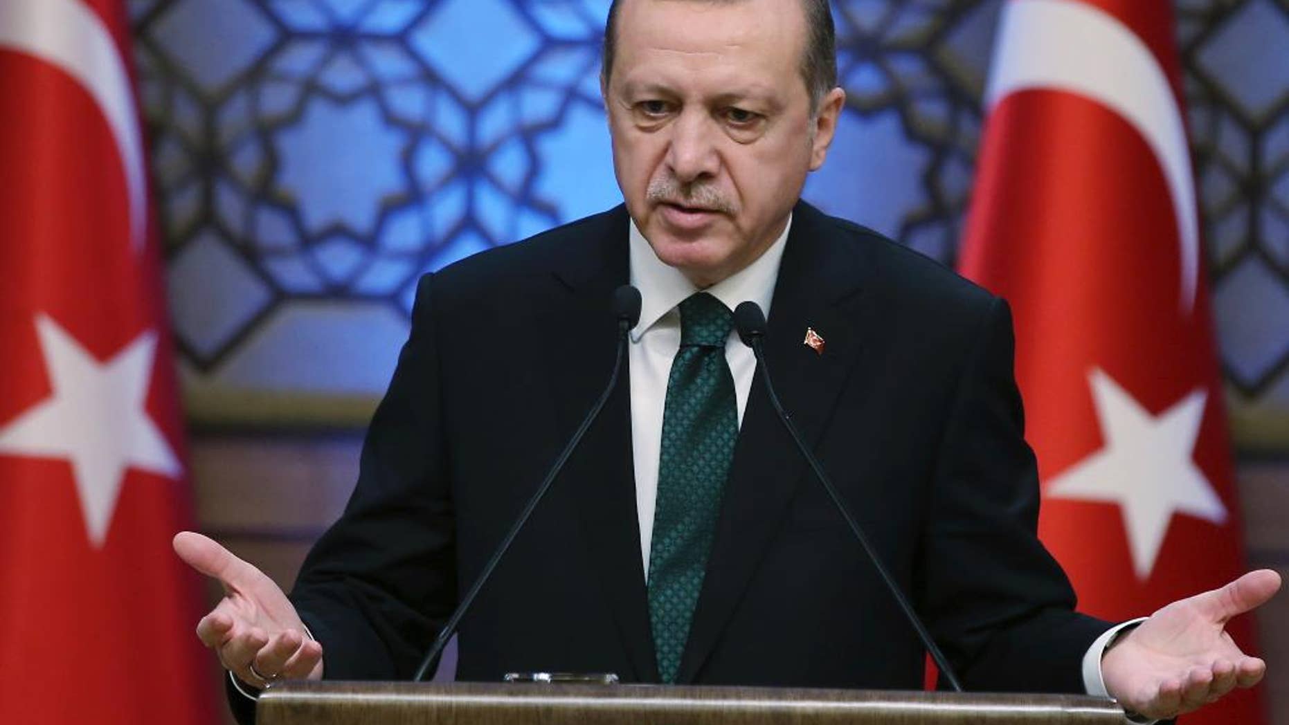 Turkey's President Recep Tayyip Erdogan addresses during an award ceremony in Ankara, Turkey, Thursday, Dec. 29, 2016. Turkey on Thursday rejected Washington's denials that it has provided weapons to a Syrian Kurdish militia force which Ankara considers to be a terrorist group and again complained about a lack of support from the U.S.-led coalition to its offensive against the Islamic State group in northern Syria. (Yasin Bulbul, Presidential Press Service, Pool photo via AP)