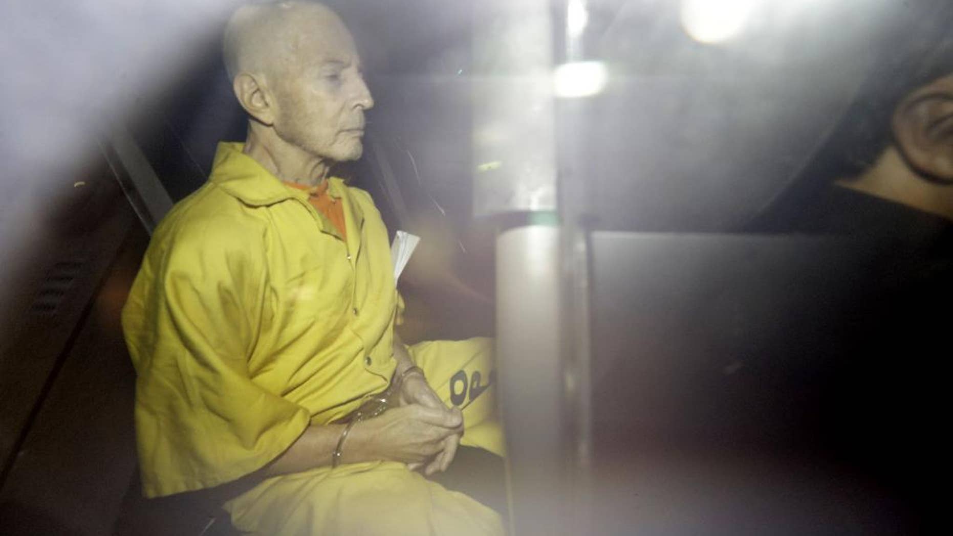FILE -In this Tuesday, April 14, 2015 file photo, Robert Durst leaves Federal Court in an Orleans Parish Sheriff's vehicle after his arraignment, in New Orleans. An attorney for jailed real estate heir Robert Durst says Thursday, April 23, 2015, state weapon charges have been dropped against the millionaire, clearing the way for federal proceedings in New Orleans on similar charges. Durst, who faces a murder charge in an unrelated California case, remains jailed without bond in Louisiana. (AP Photo/Gerald Herbert, File)