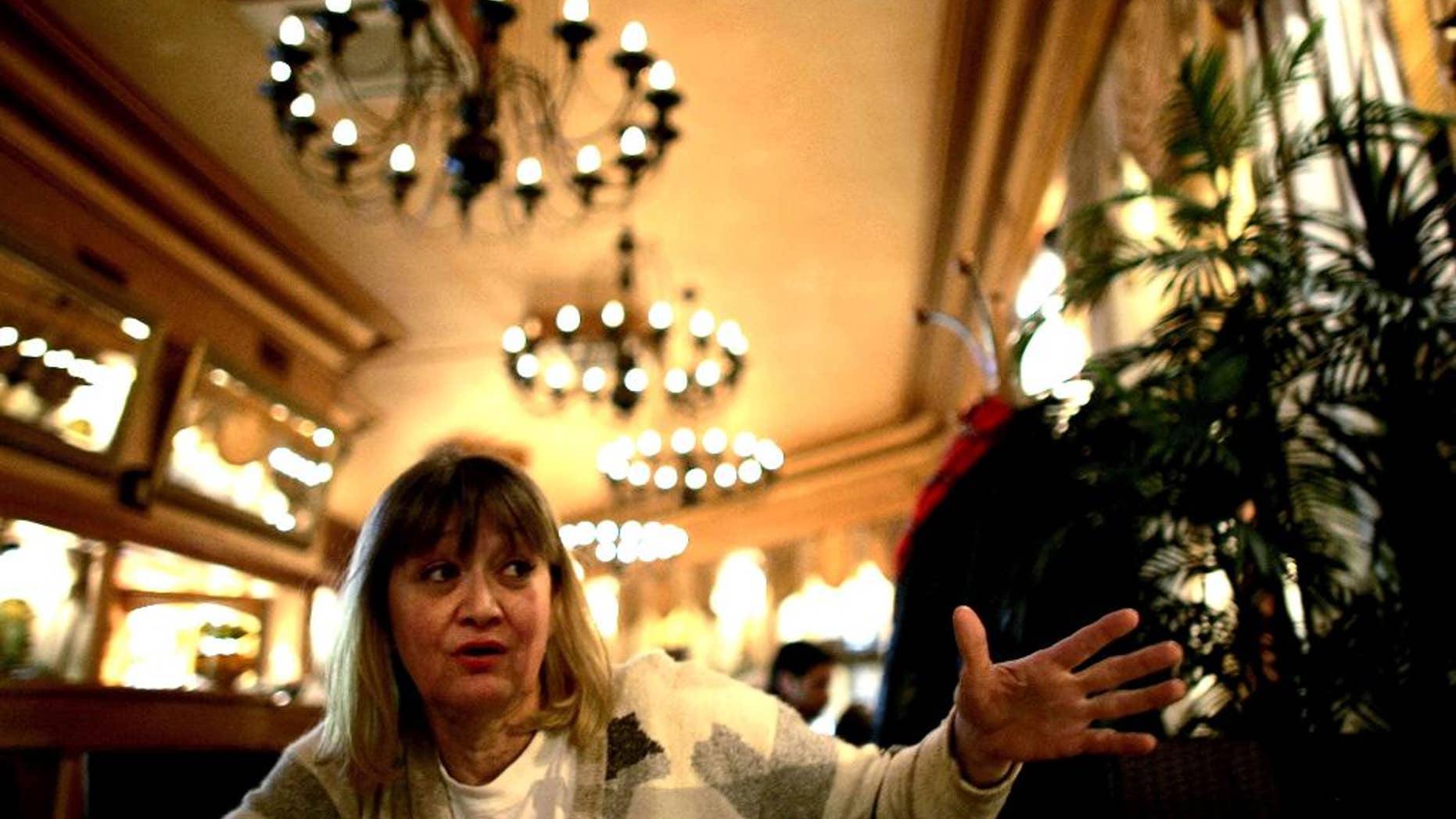 FILE-In this Friday, Feb. 15, 2008 file photo, Vesna Vulovic, an ex-air stewardess, and survivor of a fall from 10,000 meters when in 1972 her plane was blown up in mid-fight by a bomb, gestures as she gives an interview to the Associated Press in Belgrade, Serbia. Serbia's state TV reports Saturday Dec. 24, 2016, Vulovic was found dead by her friends in her apartment in Belgrade, aged 66. (AP Photo/Marko Drobnjakovic)