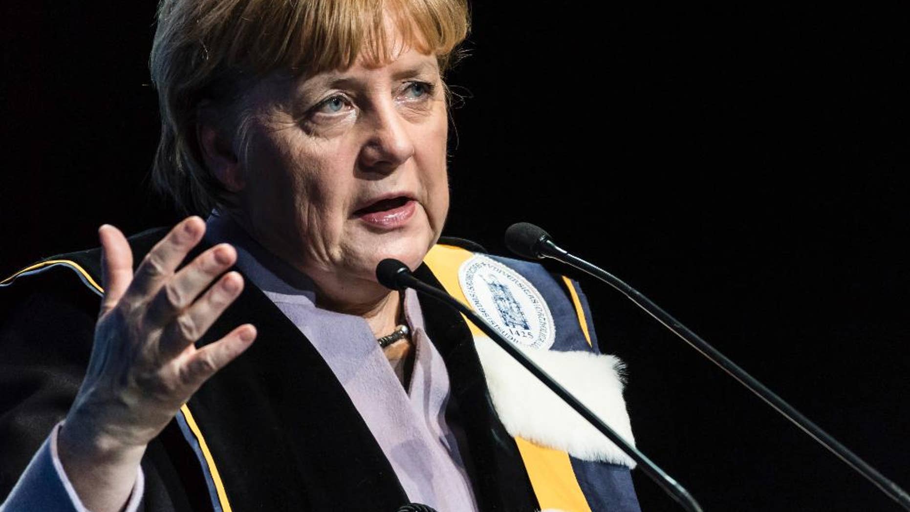 German Chancellor Angela Merkel talks after she was given an honorary doctorate by the University of Leuven and the University of Ghent during an academic ceremony in Brussels on Thursday Jan. 12, 2017. Merkel received the honorary doctorate for her diplomatic and political efforts to develop the political strength of Europe, and to defend the values that allow Europe to find unity in diversity. (AP Photo/Geert Vanden Wijngaert)