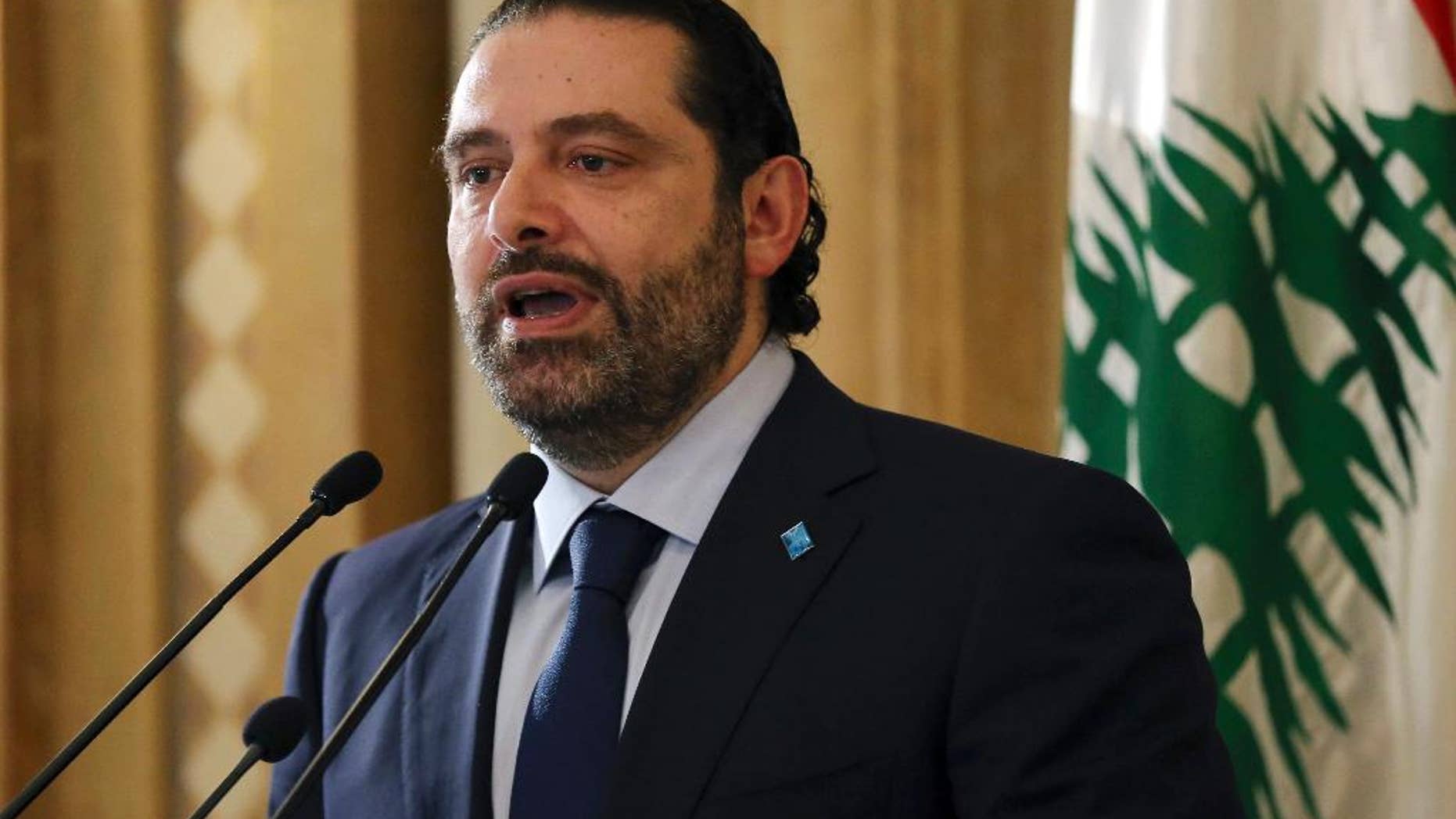 FILE -In this October 20, 2016, file photo, Lebanese Prime Minister Saad Harir speaks in Beirut, Lebanon. Hariri is appealing for the international community to invest in the country's infrastructure and educational system to help alleviate the enormous burden of hosting more than a million Syrian refugees. (AP Photo/Hussein Malla, File)