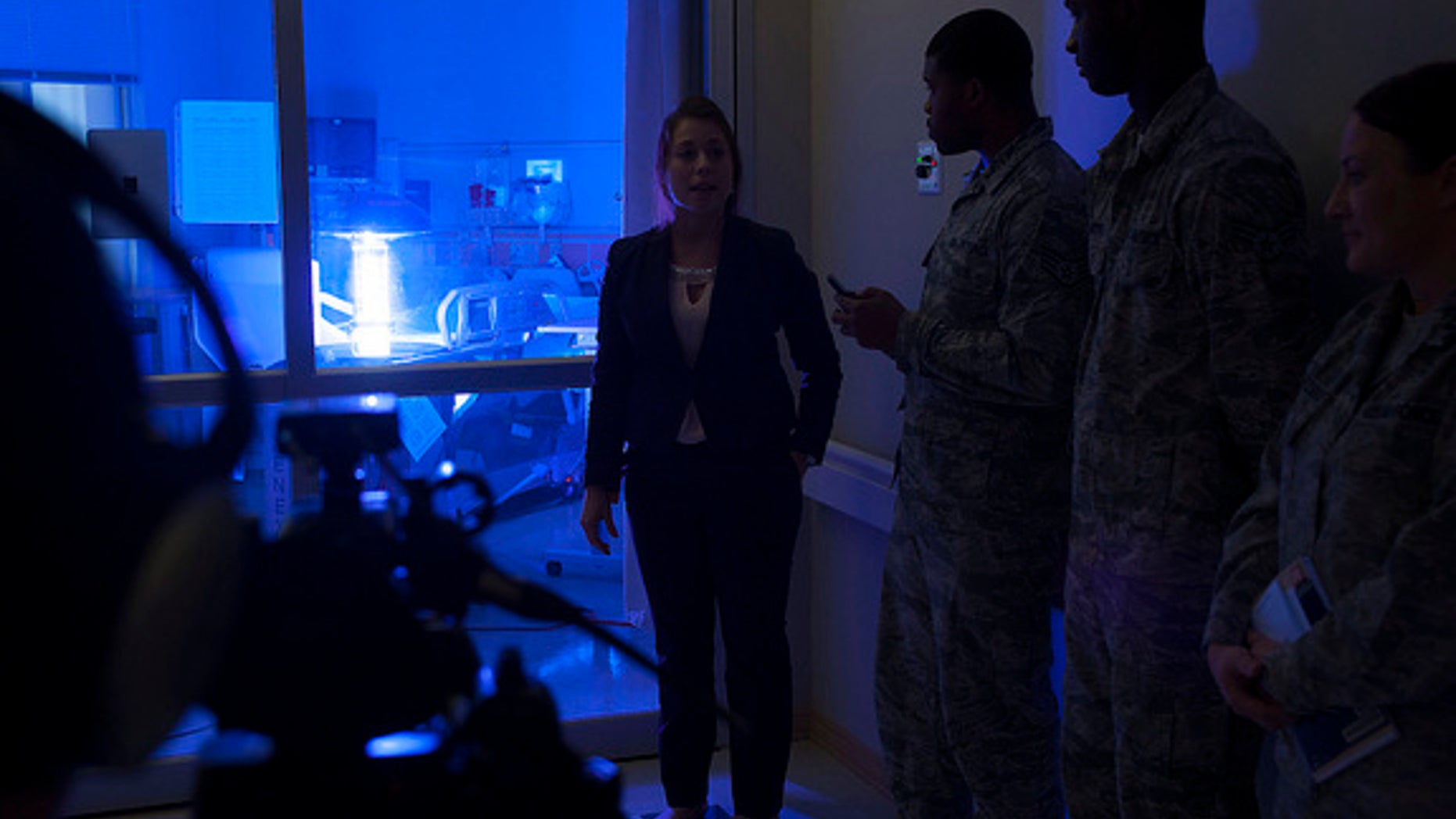 A spokesperson for the company that made the robot explains how the machine works to staff at Hospital Langley.