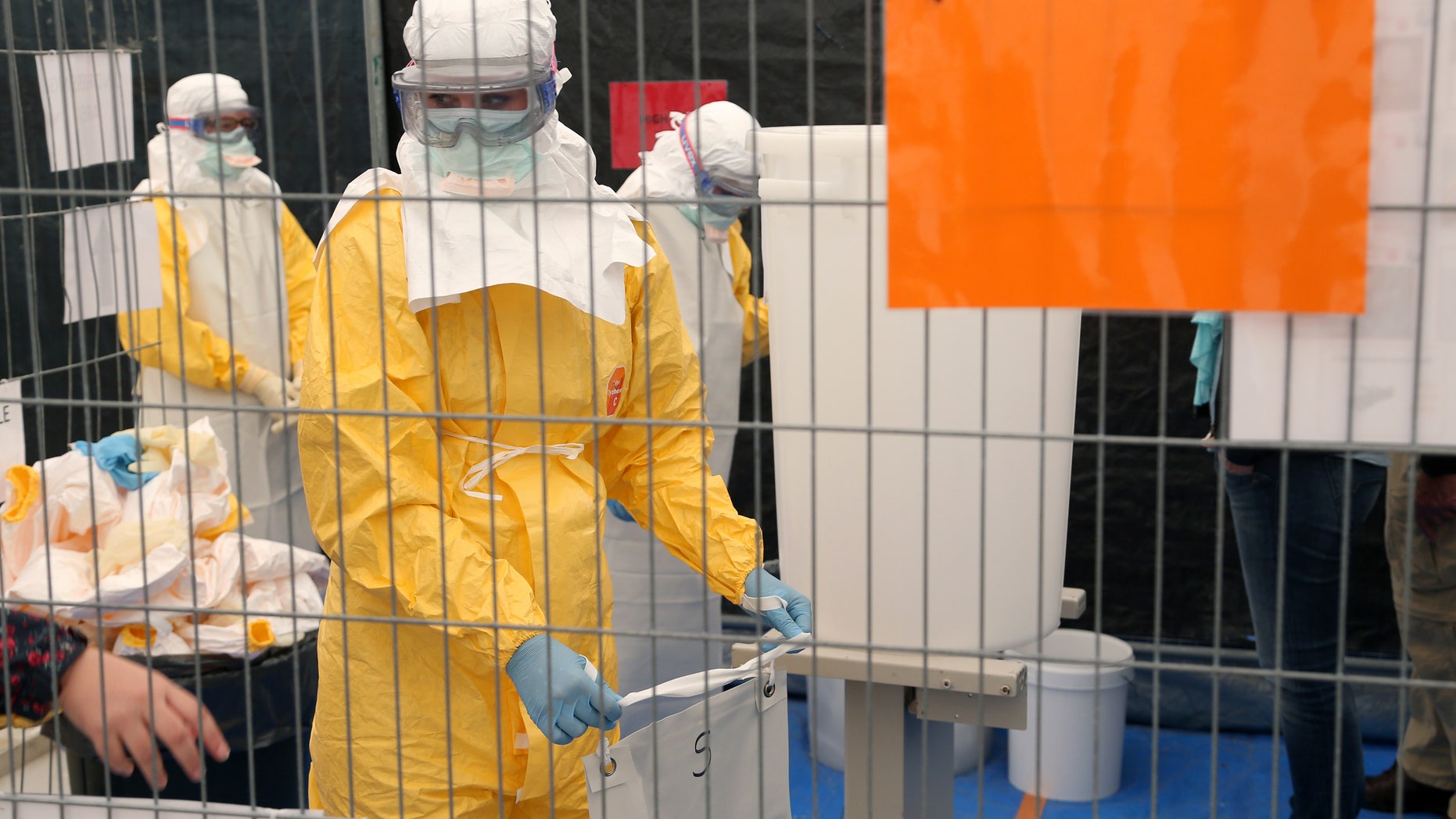 A volunteer for Medecins Sans Frontieres (MSF), or Doctors Without Borders, receives training on how to handle personal protective equipment during courses in Brussels October 15, 2014, which is aimed to help deal with the Ebola disease in West Africa. REUTERS/Francois Lenoir
