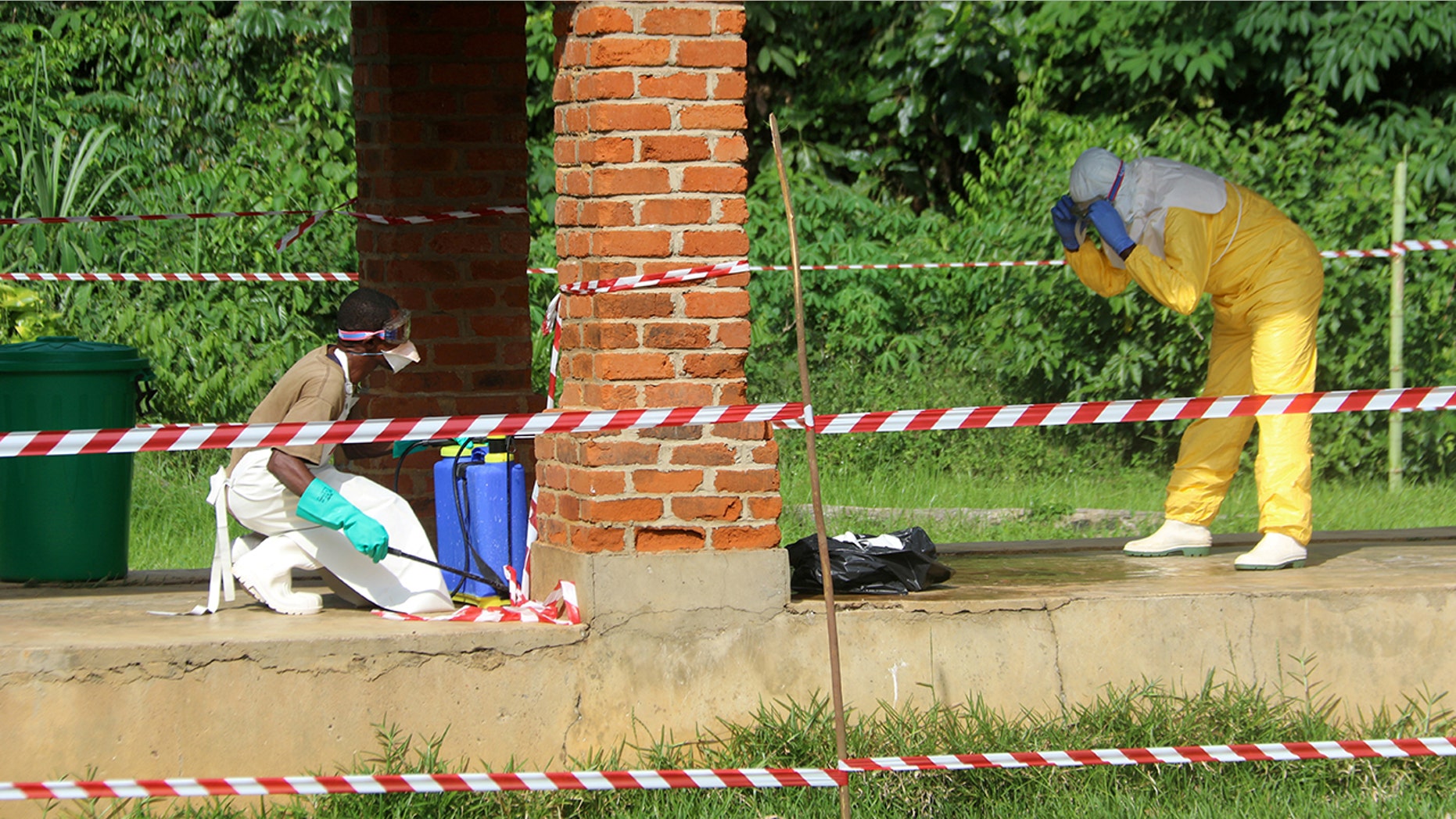 May 12, 2018: A health worker is sprayed with chlorine after visiting Bikoro hospital, where a patient with suspected Ebola was being evaluated