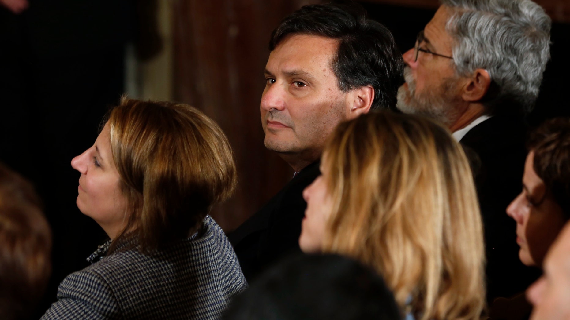 Ebola czar Ron Klain (C) listens in the White House East Room as the U.S. President Barack Obama delivers a statement about the government's Ebola response in Washington, October 29, 2014. REUTERS/Larry Downing
