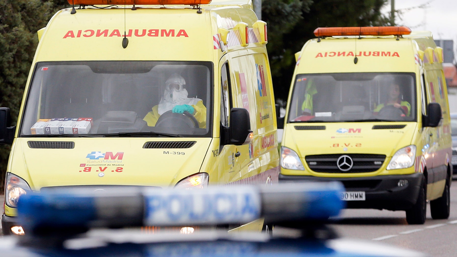 Two ambulances arrive at Madrid's Carlos III Hospital October 16, 2014. The ambulance in the front was carrying a person suspected of having Ebola, according to the police escort. REUTERS/Juan Medina