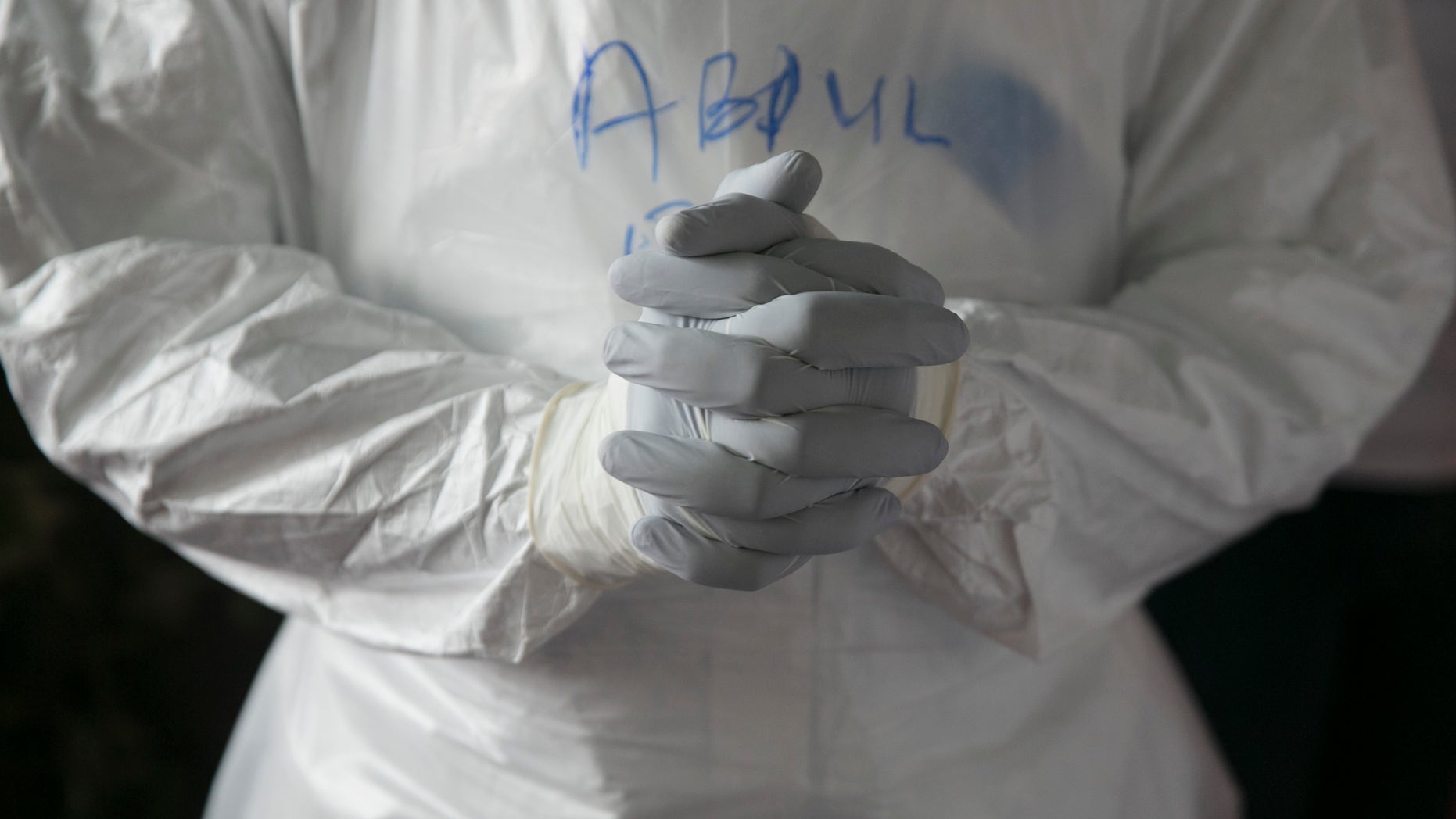 A Sierra Leonean doctor practises wearing protective clothing in the Ebola Training Academy in Freetown, Sierra Leone, December 16, 2014. REUTERS/Baz Ratner
