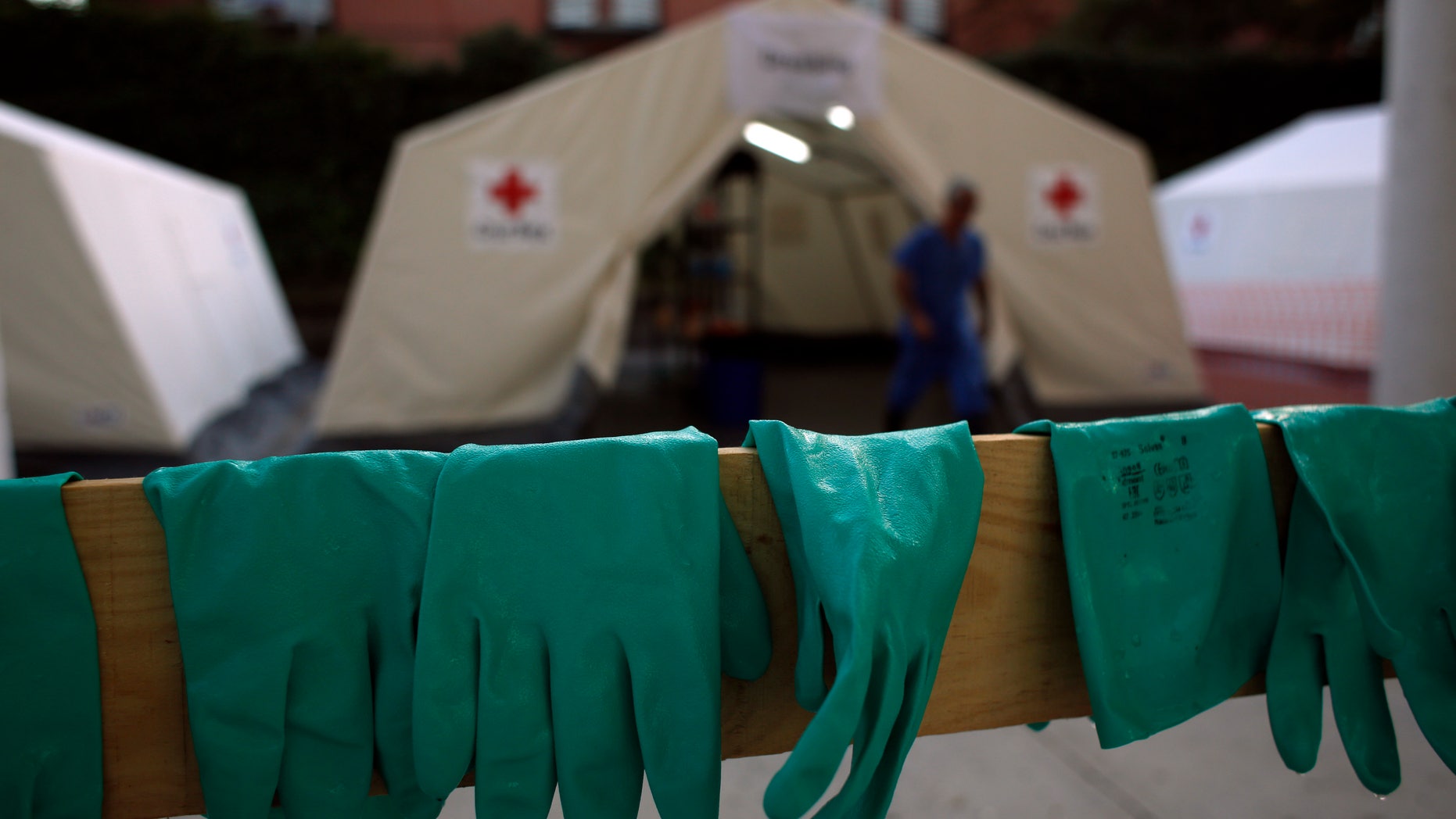 Gloves are left to dry after an Ebola training session held by Spain's Red Cross in Madrid October 29, 2014. REUTERS/Susana Vera