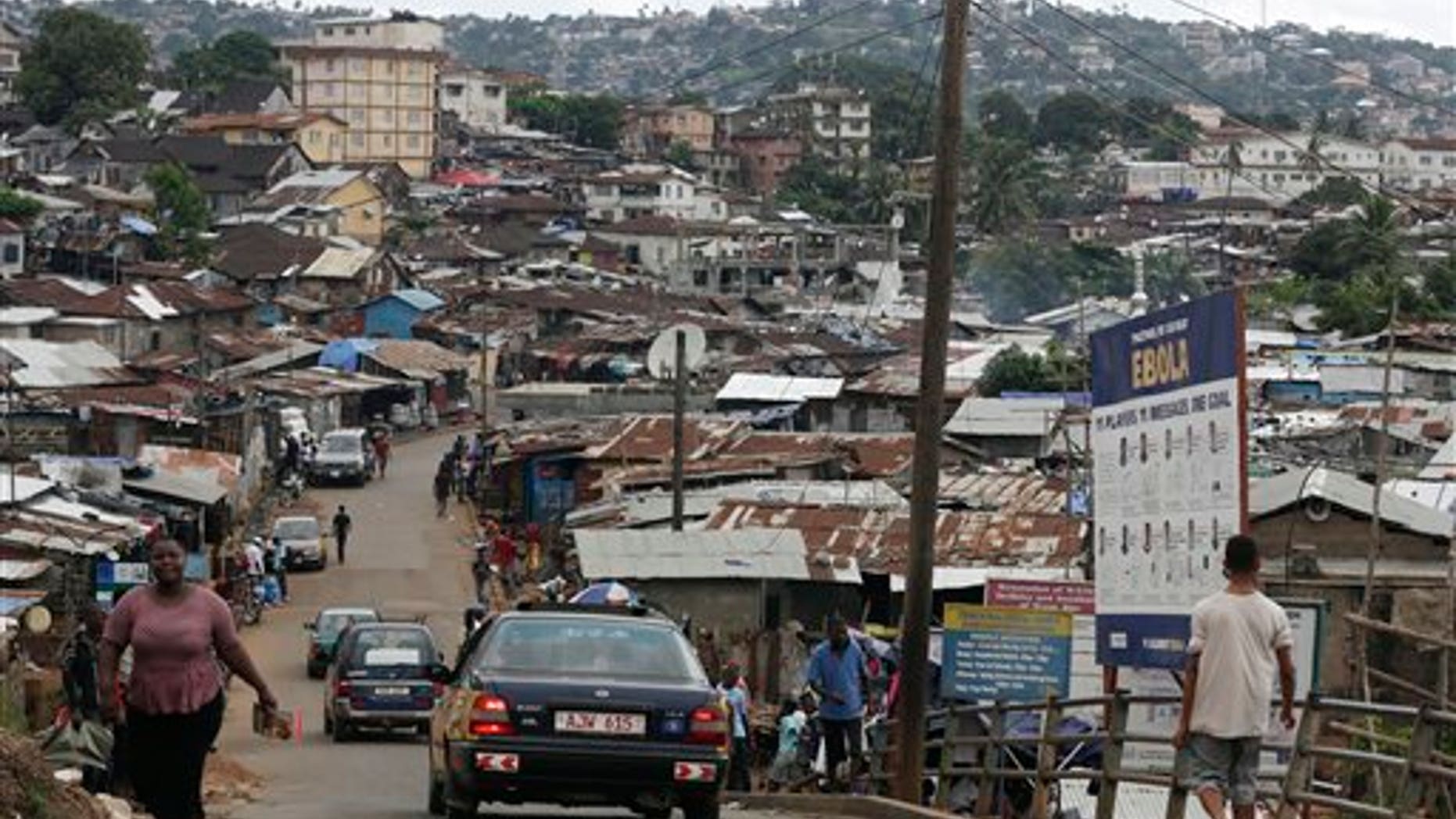 In this photo taken Thursday, Aug. 13, 2015, a billboard advises people how to keep free of Ebola, in a shanty town on the outskirts of Freetown, Sierra Leone. (AP Photo/Sunday Alamba)