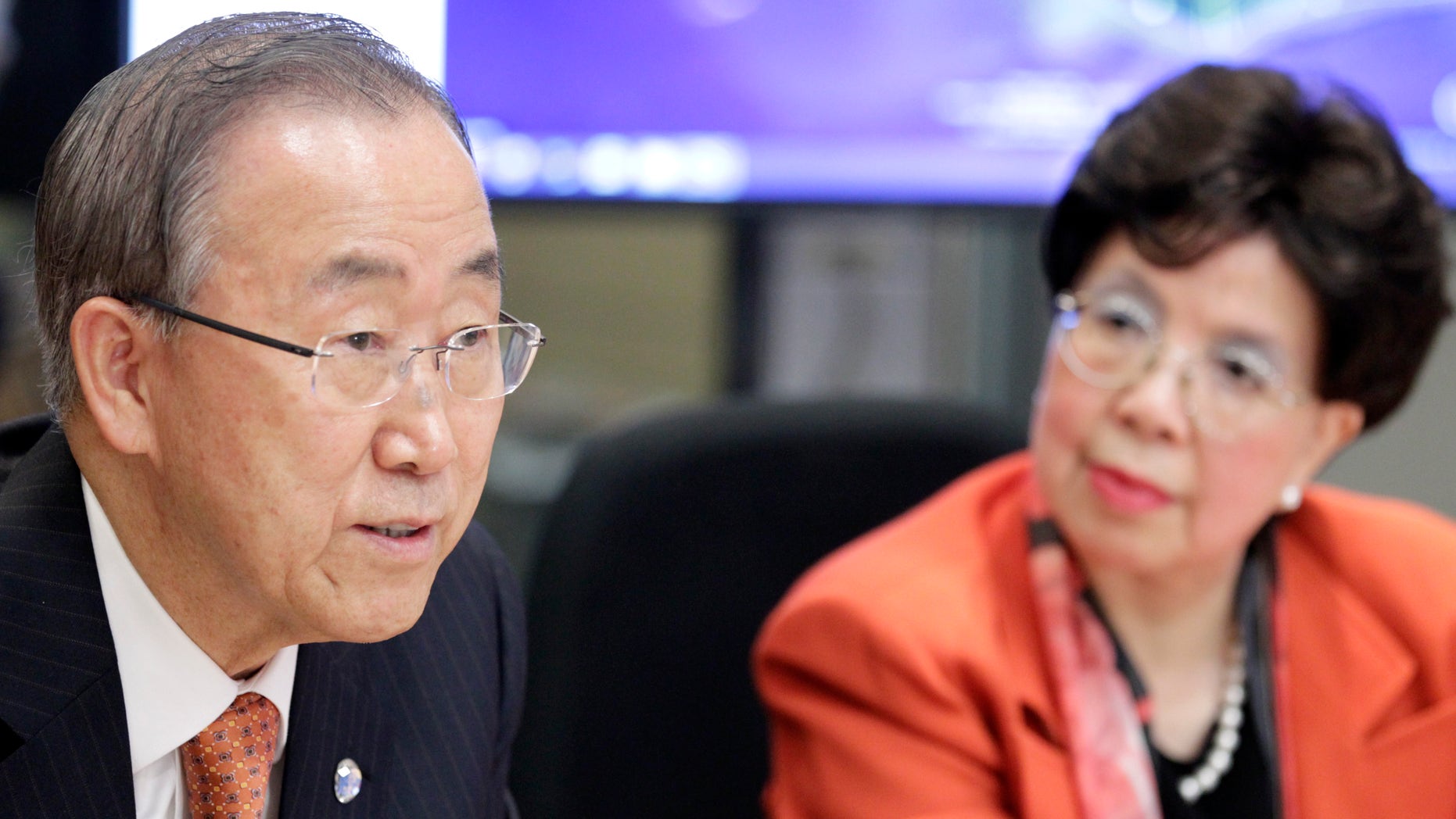 United Nations Secretary-General Ban Ki-moon (L) and World Health Organization(WHO) Director-General Margaret Chan attend a meeting in the WHO Strategic Health Operations Centre (SHOC) room at the WHO headquarters in Geneva October 1, 2014. REUTERS/Pierre Albouy