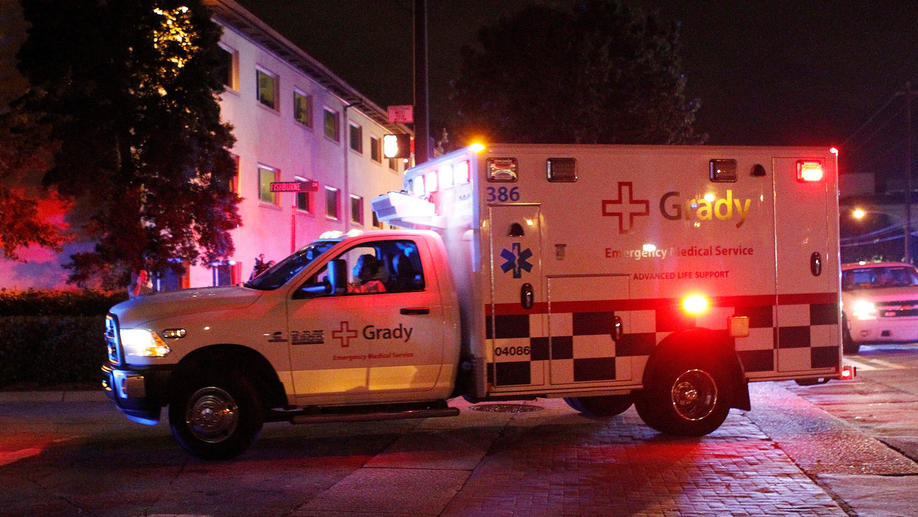 An ambulance transporting Amber Joy Vinson, a U.S. nurse who has Ebola, arrives at Emory University Hospital in Atlanta, Georgia October 15, 2014. REUTERS/Tami Chappell