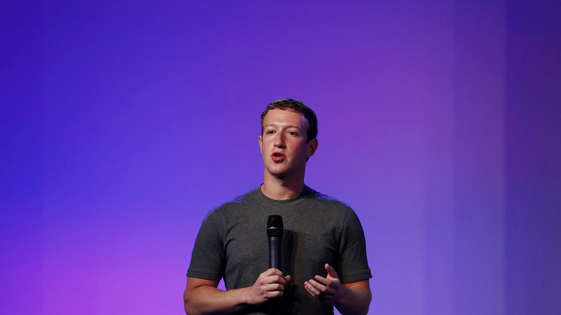 Mark Zuckerberg, founder and CEO of Facebook, addresses a gathering during the Internet.org Summit in New Delhi October 9, 2014. REUTERS/Adnan Abidi