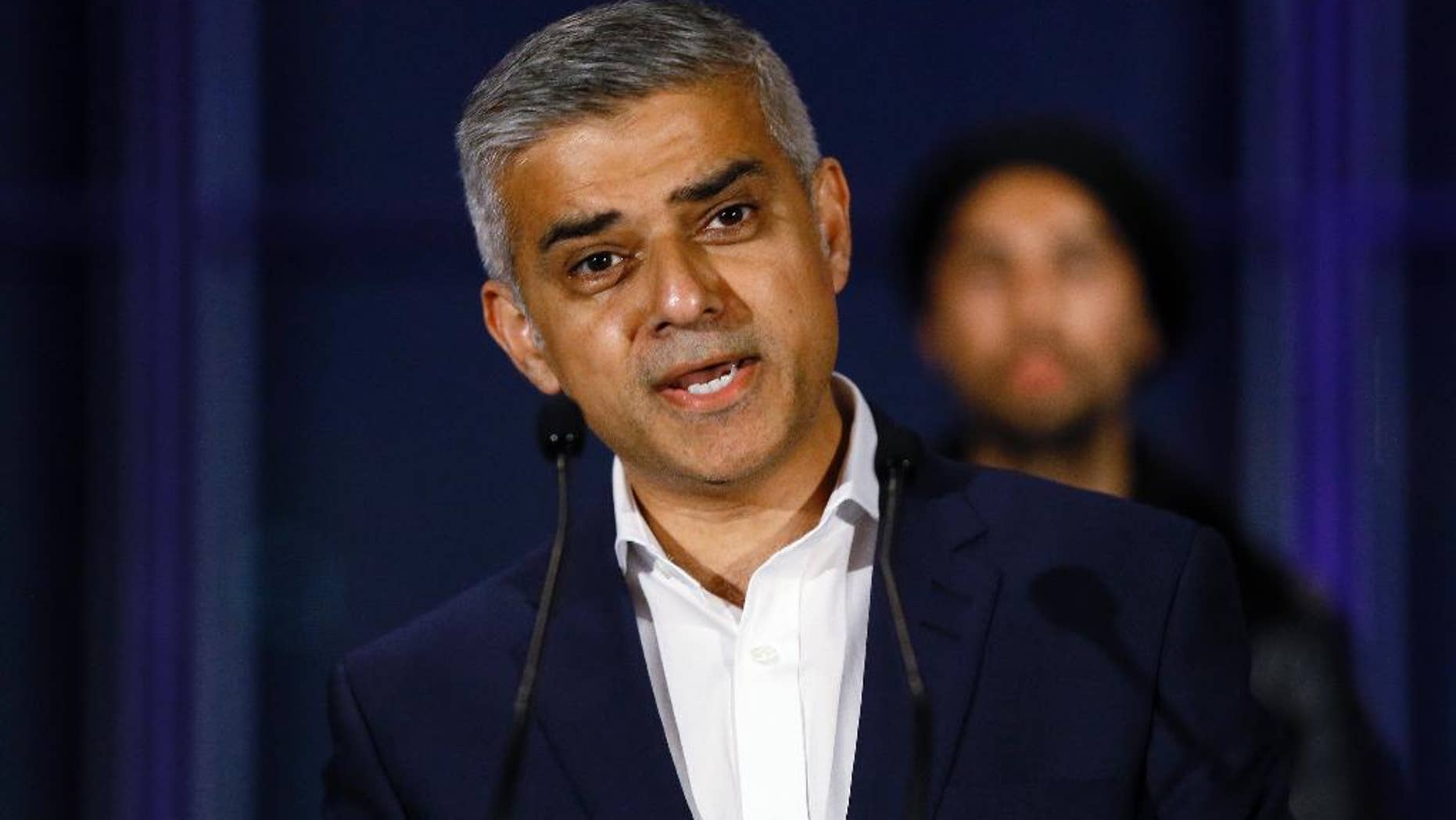FILE - In this file photo dated Saturday, May 7, 2016, Sadiq Khan, speaks on the podium at City Hall in London, Saturday, May 7, 2016. London’s mayor, Khan on Sunday June 12, 2016, pledged to fight until the moment the polls close to persuade Britons to vote to remain inside the European Union bloc, in the upcoming June 23 referendum.(AP Photo/Kirsty Wigglesworth, FILE)