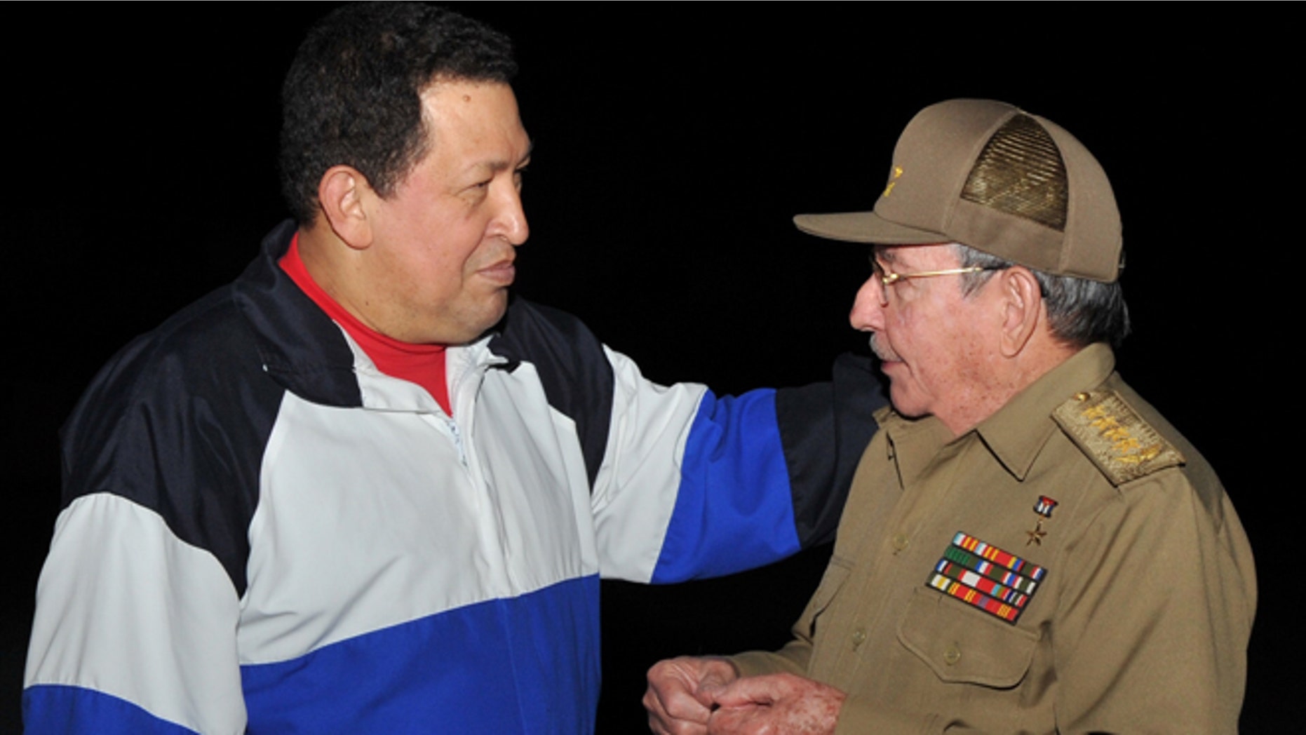 Dec. 10, 2012: In this picture released Tuesday, Dec. 11, 2012 by Cuba's state newspaper Granma, Cuba's President Raul Castro, right, receives Venezuela's President Hugo Chavez at the Jose Marti International airport in Havana, Cuba.