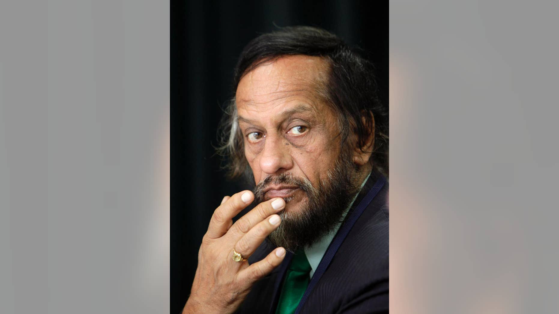 FILE - In this Dec. 1, 2009, file photo, Chairman of the United Nations panel on climate change Rajendra Pachauri looks on at a press conference in New Delhi, India. The former chairman of the U.N. climate panel has been removed from his job as head of a top energy institute in India following allegations of sexual harassment. The Energy and Resources Institute announced late Thursday, July 23, 2015 that Pachauri would be replaced by Arun Mathur, an energy efficiency expert. (AP Photo/Gurinder Osan, File)