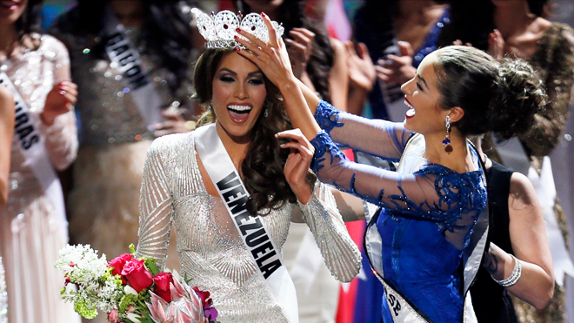 FILE - In this Nov. 9, 2013 file photo, Miss Universe 2012 Olivia Culpo, from the United States, right, places the crown on Miss Venezuela Gabriela Isler during the 2013 Miss Universe pageant in Moscow, Russia. Isler is scheduled to attend a news conference, Thursday, Oct. 2, 2014, along with pageant owner Donald Trump to announce the next Miss Universe pageant. (AP Photo/Pavel Golovkin, File)
