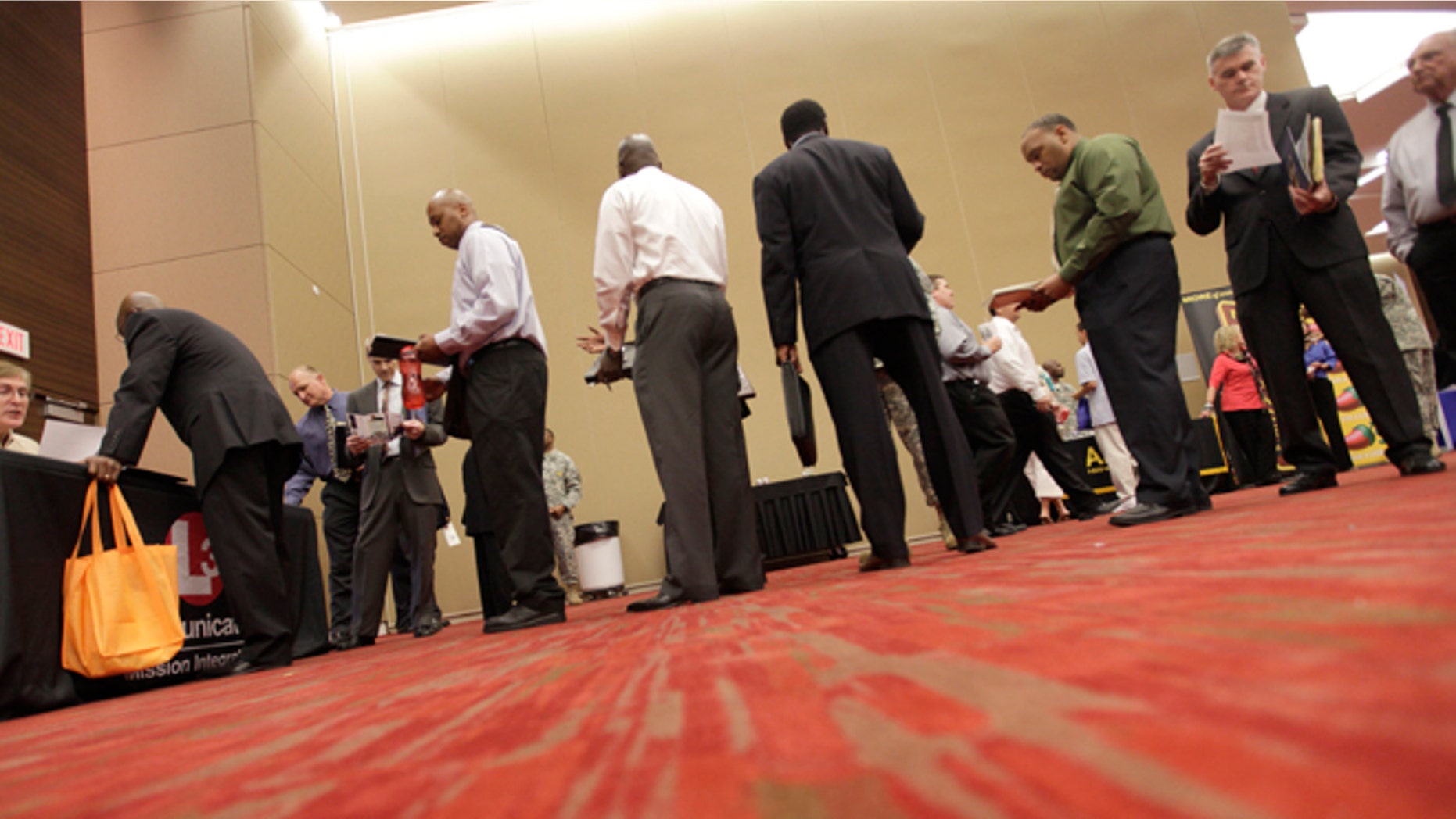 July 19, 2012: Job seekers line up to speak to a recruiter during a job fair in Irving, Texas.