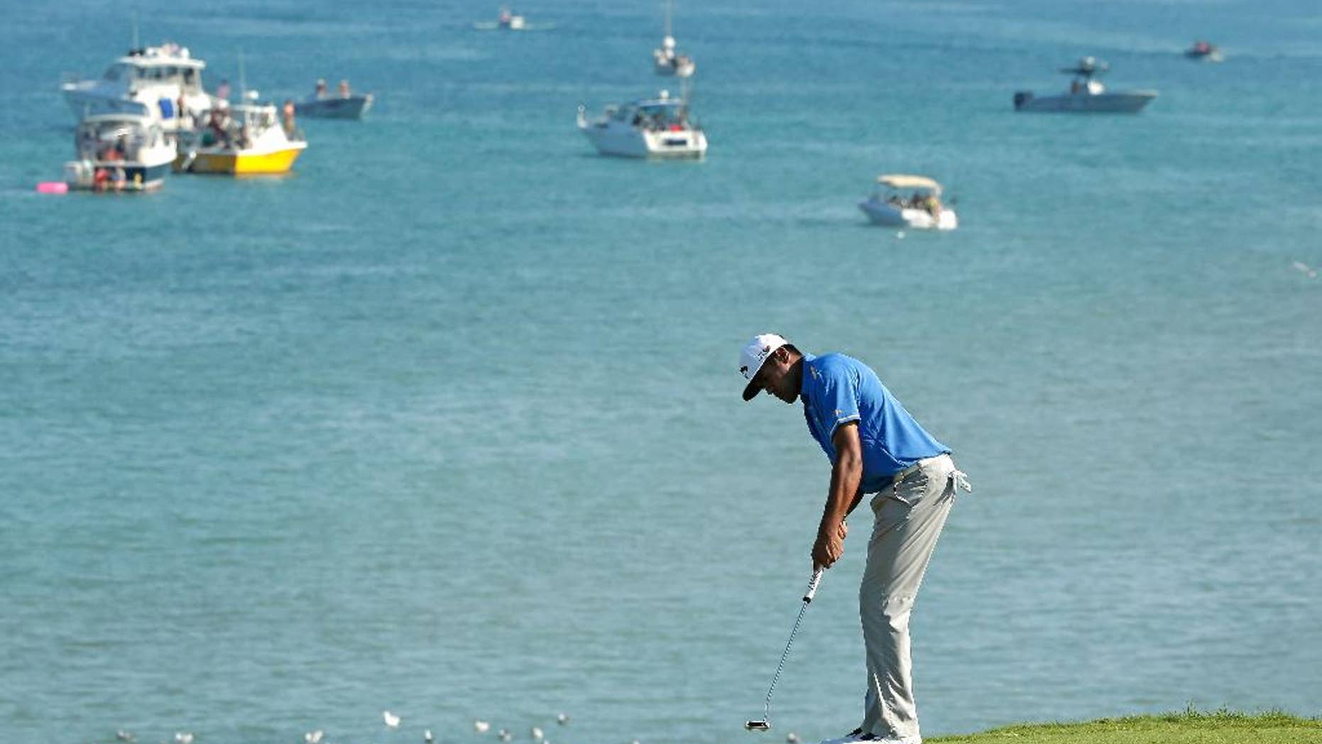 Tony Finau putts on the eighth hole during the third round of the PGA Championship golf tournament Saturday, Aug. 15, 2015, at Whistling Straits in Haven, Wis. (AP Photo/Chris Carlson)