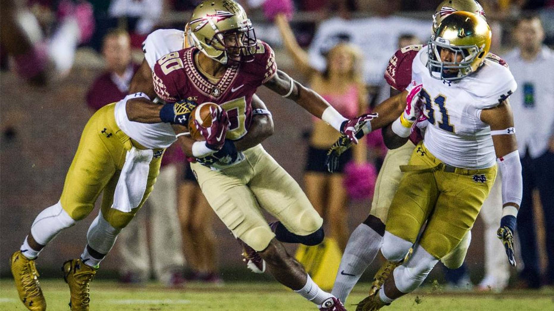 Florida State's Rashad Greene (80) returns a kickoff in the first half of an NCAA college football game against Notre Dame in Tallahassee, Fla., Saturday, Oct. 18, 2014. (AP Photo/Mark Wallheiser)