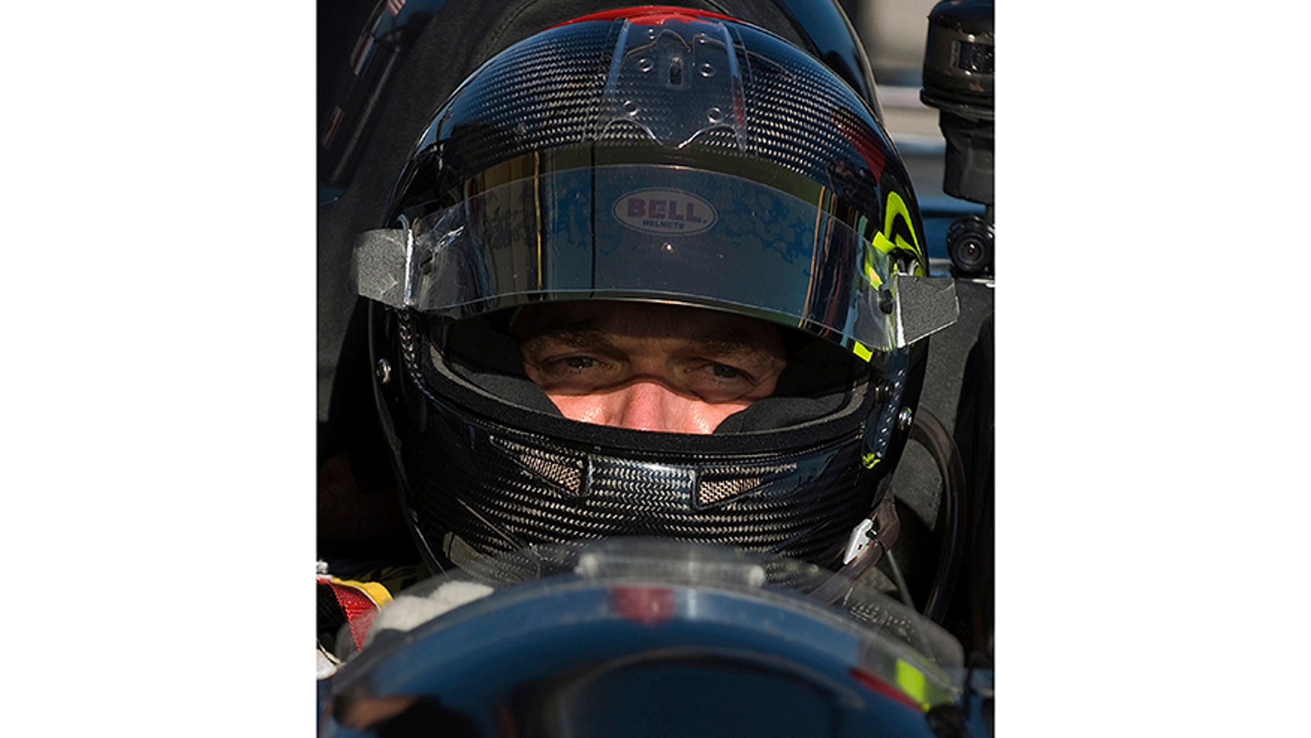 FILE- In this March 19, 2010 file photo, Level 5 Motorsports driver Scott Tucker waits in his Oreca FLM09 on pit row during a break in the morning practice session for the American Le Mans Series' 12 Hours of Sebring auto race in Sebring, Fla. Tucker and his accountant have been indicted on federal charges of failing to report millions in income from a payday lending business that has been ruled fraudulent. The U.S. attorney's office in Kansas said Wednesday, Dec. 20, 2017 that Tucker is charged with filing a false return and the accountant, W. Brett Chapin, of aiding him. (AP Photo/Steve Nesius, File)