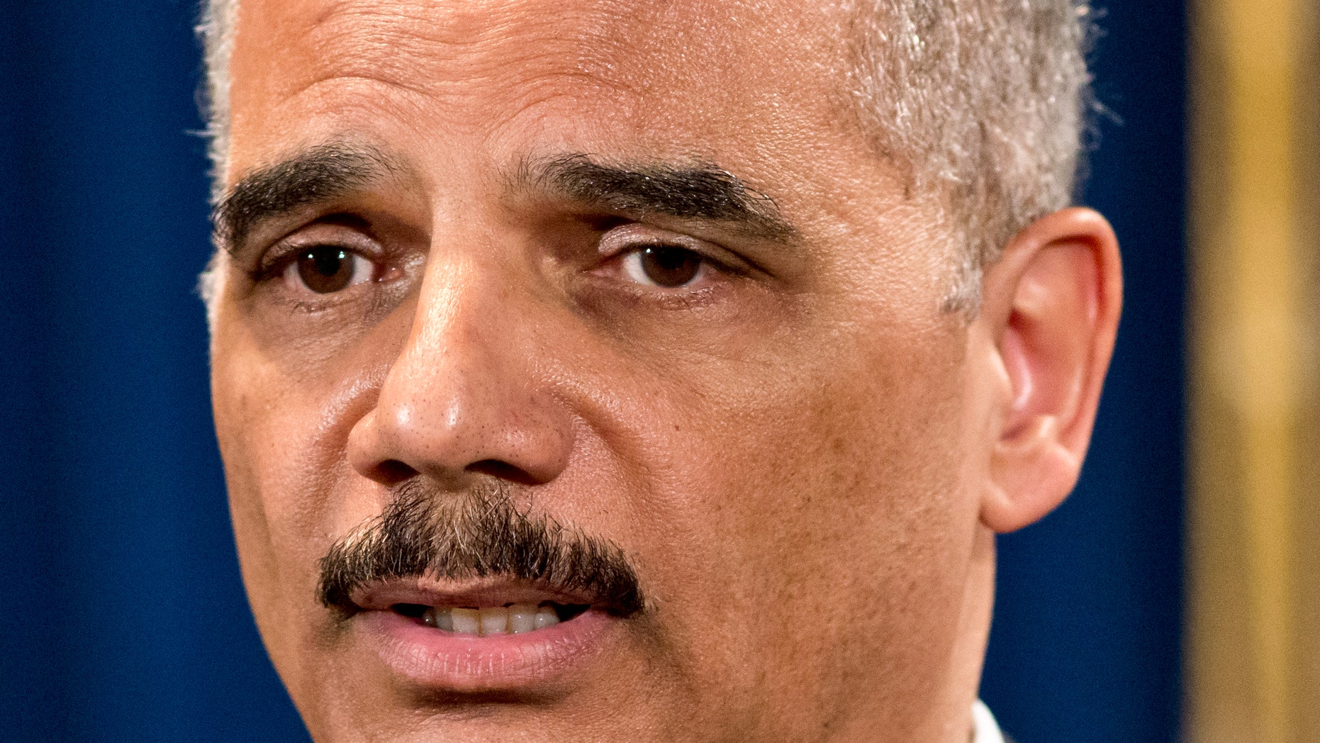 Attorney General Eric Holder is questioned about the Justice Department secretly obtaining two months of telephone records of reporters and editors for The Associated Press, during a news conference at the Justice Department in Washington, Tuesday, May 14, 2013. In what the news cooperative's top executive called a "massive and unprecedented intrusion," the Justice Department monitored outgoing calls for the work and personal phone numbers of individual reporters, for general AP office numbers in New York, Washington and Hartford, Conn., and for the main number for the AP in the House of Representatives press gallery, according to attorneys for the AP. (AP Photo/J. Scott Applewhite)