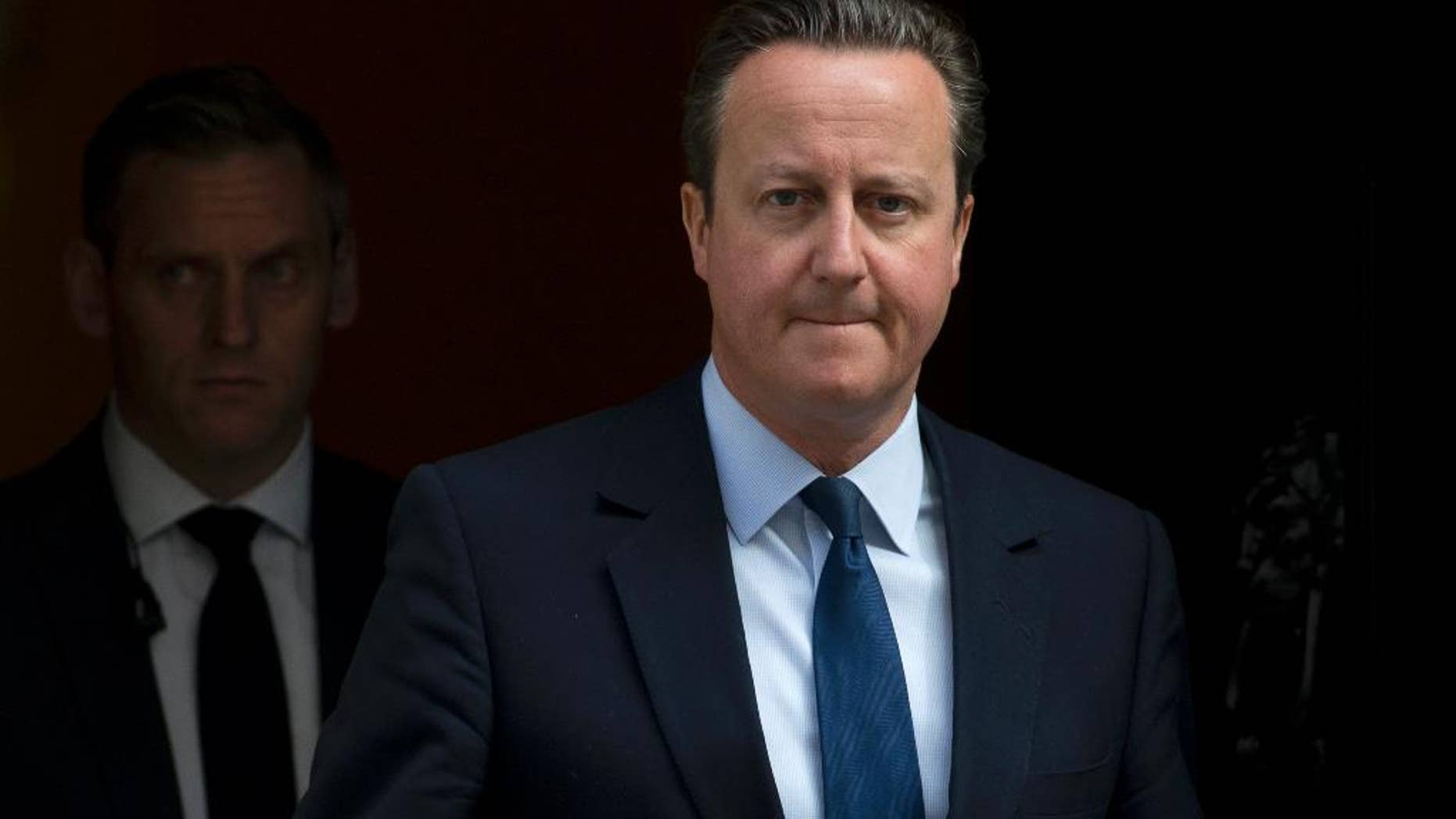 Britain's Prime Minister David Cameron leaves 10 Downing Street for the House of Commons to attend his weekly Prime Ministers Questions in London, Wednesday, April, 27, 2016. (AP Photo/Alastair Grant)