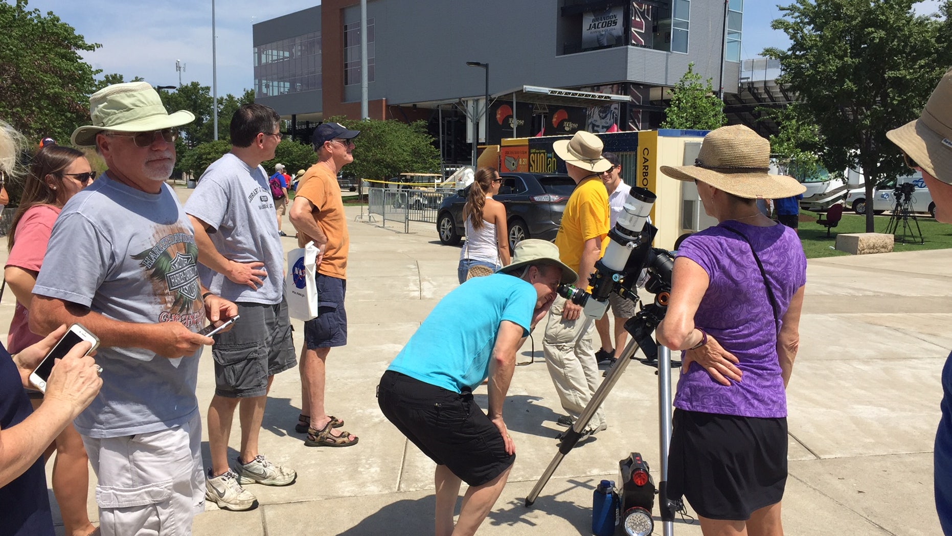 In Carbondale, Illinois, people look through a solar-viewing telescope in preparation for the total solar eclipse on Monday (Aug. 21).