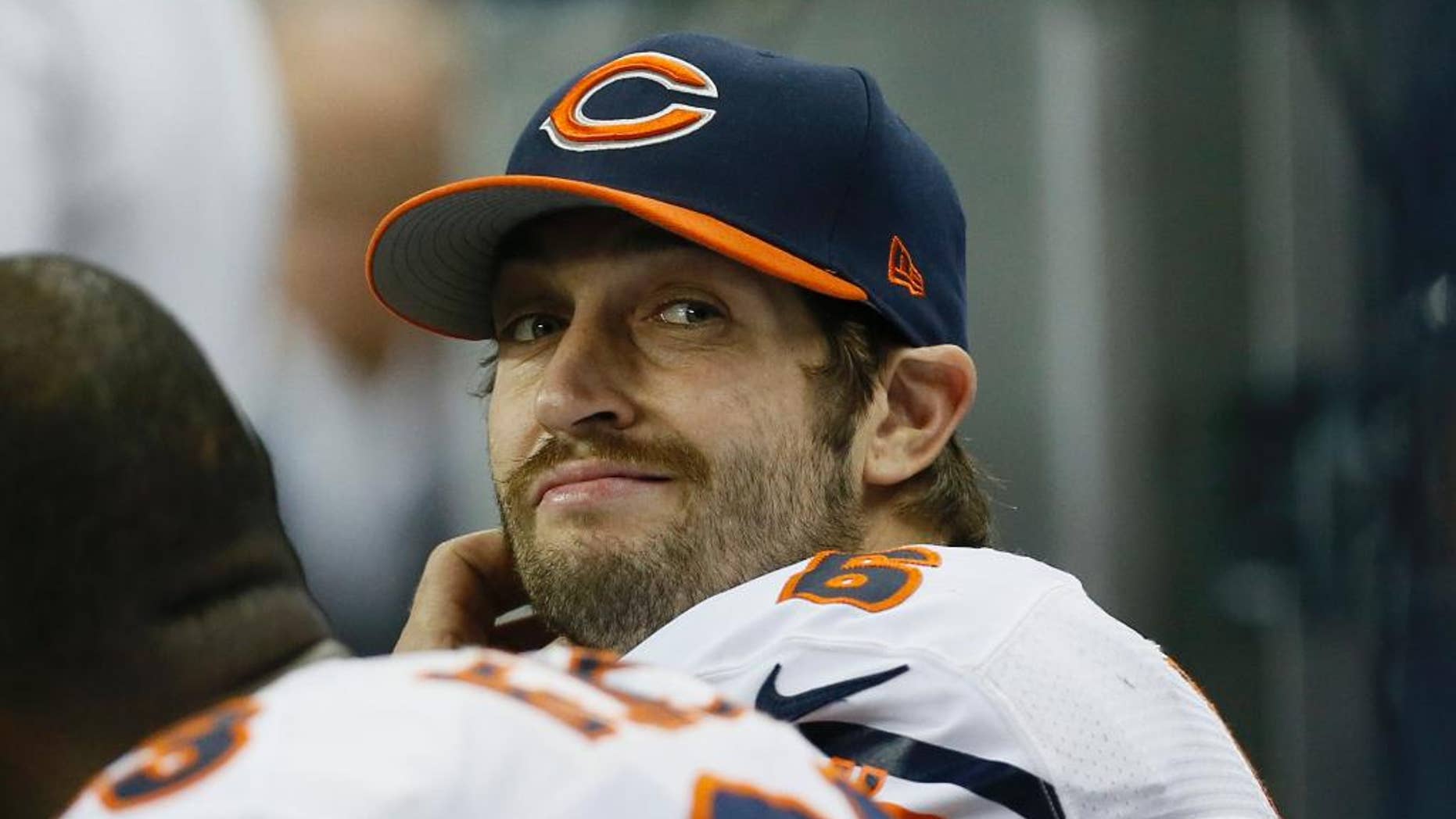 Chicago Bears quarterback Jay Cutler looks towards the scoreboard during the second half of an NFL football game against the Detroit Lions in Detroit, Thursday, Nov. 27, 2014. (AP Photo/Paul Sancya)
