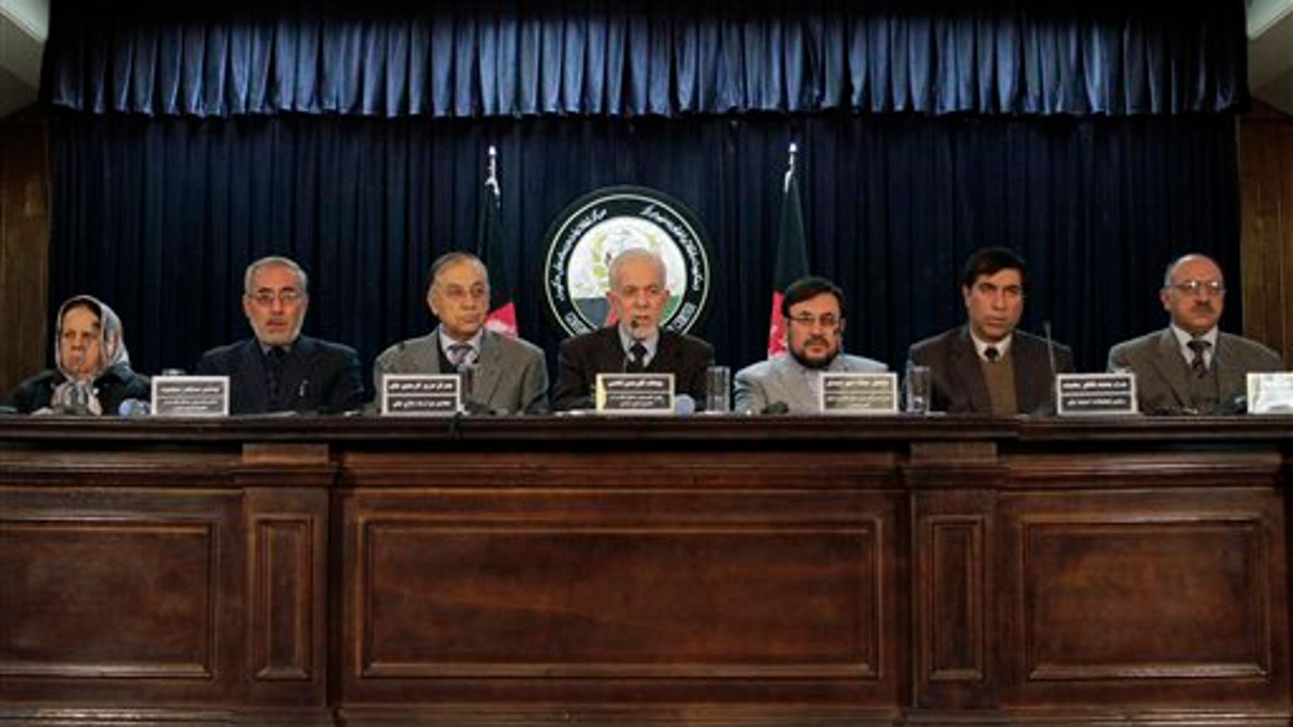Jan. 7: Gul Rahman Qazi, center, head of an Afghan investigative commission, speaks during a news conference in Kabul, Afghanistan.