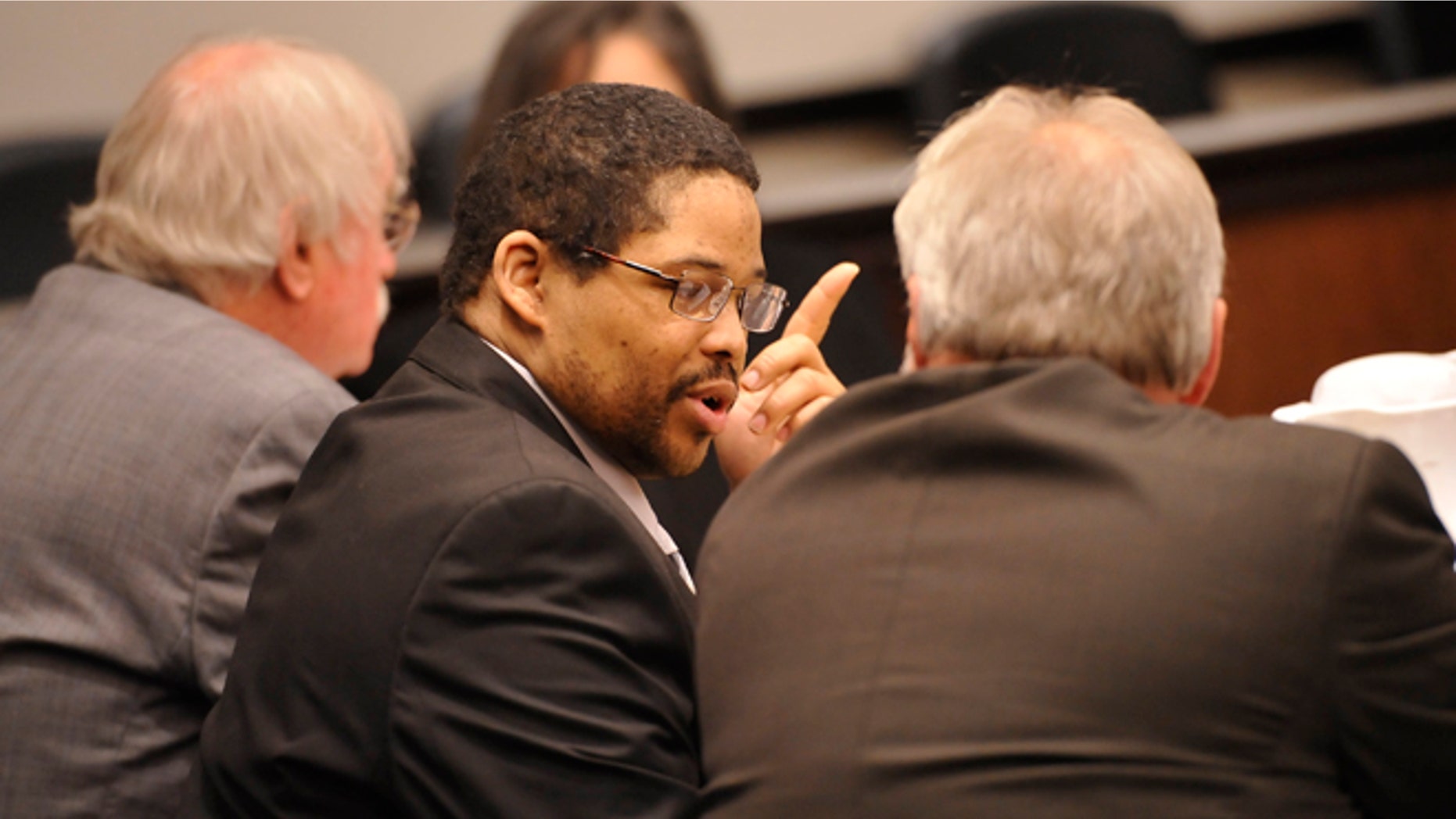 April 22, 2013: In this file photo, Bartholomew Granger, center, is flanked by attorneys James Makin, right, and Sonny Cribbs before the start of his trial in Galveston, Texas.