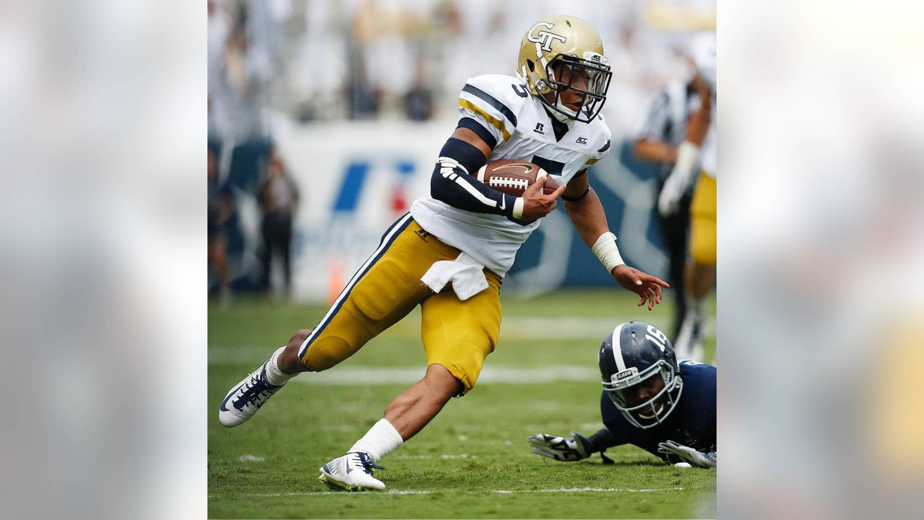 Georgia Tech quarterback Justin Thomas (5) runs against Georgia Southern during the first half of an NCAA college football game, Saturday, Sept. 13, 2014, in Atlanta. (AP Photo/Mike Stewart)