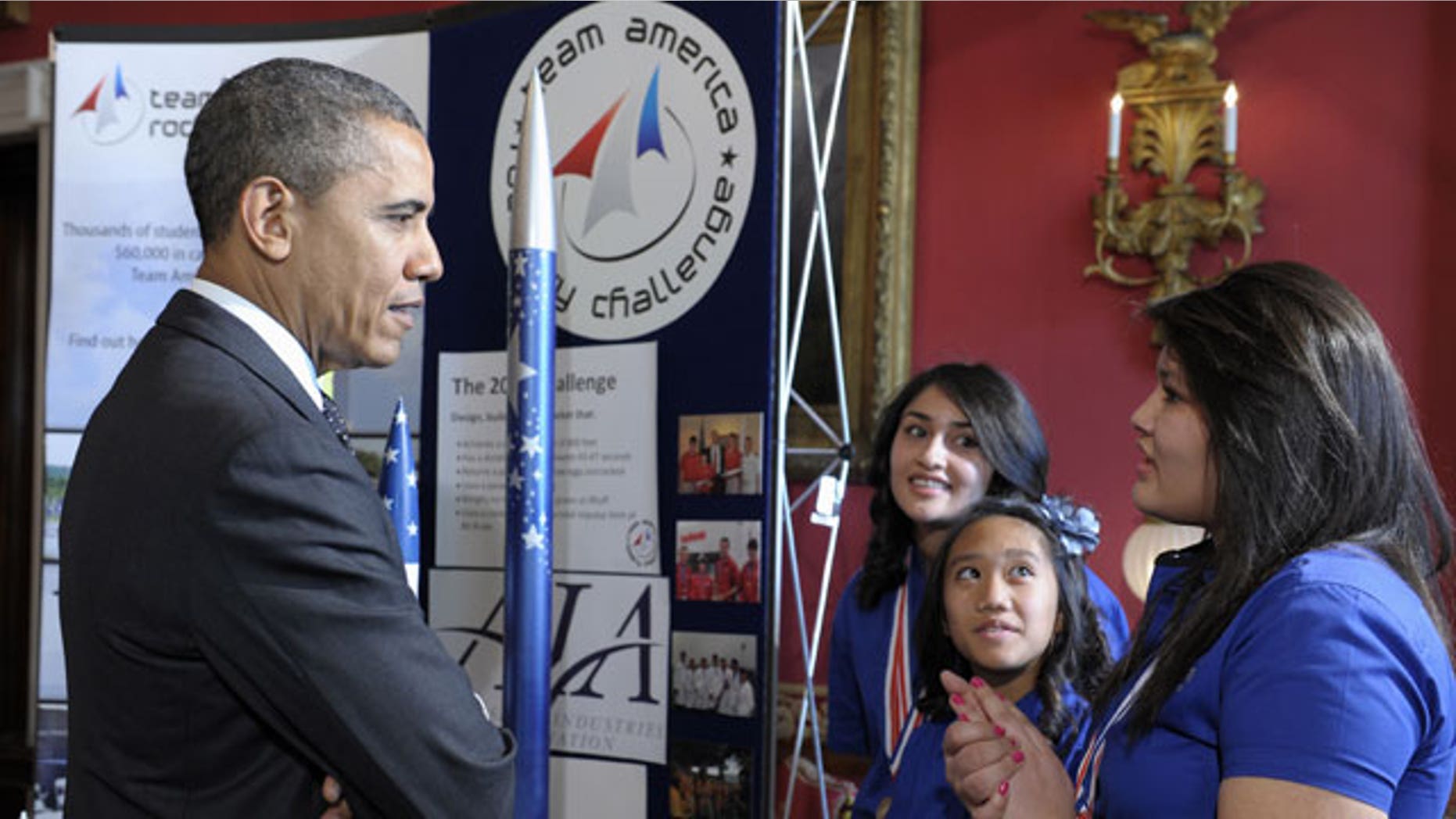 Feb. 7, 2012: President Barack Obama talks with, from left, Janet Nieto, Gwynelle Condino, and Ana Nieto, all from Presidio, Texas, in the State Dining Room of the White House in Washington during the White House Science Fair.