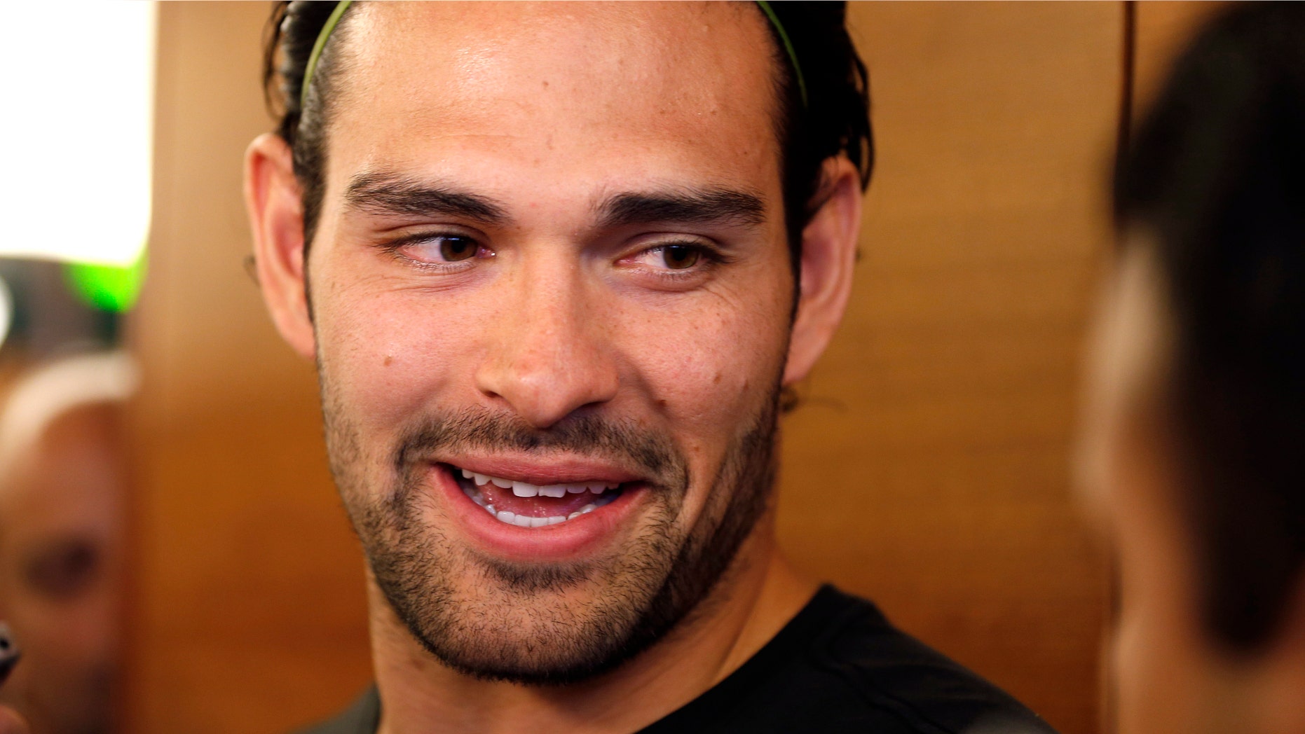 New York Jets quarterback Mark Sanchez talks to reporters during a locker room availability at their NFL practice practice facility in Florham Park, N.J., Thursday, May 2, 2013. The Jets may have cut Tim Tebow but their situation at quarterback is far from settled. New general manager John Idzik says Sanchez, David Garrard, Greg McElroy, Matt Simms and second-round draft pick Geno Smith are all candidates to be the starter. (AP Photo/Rich Schultz)