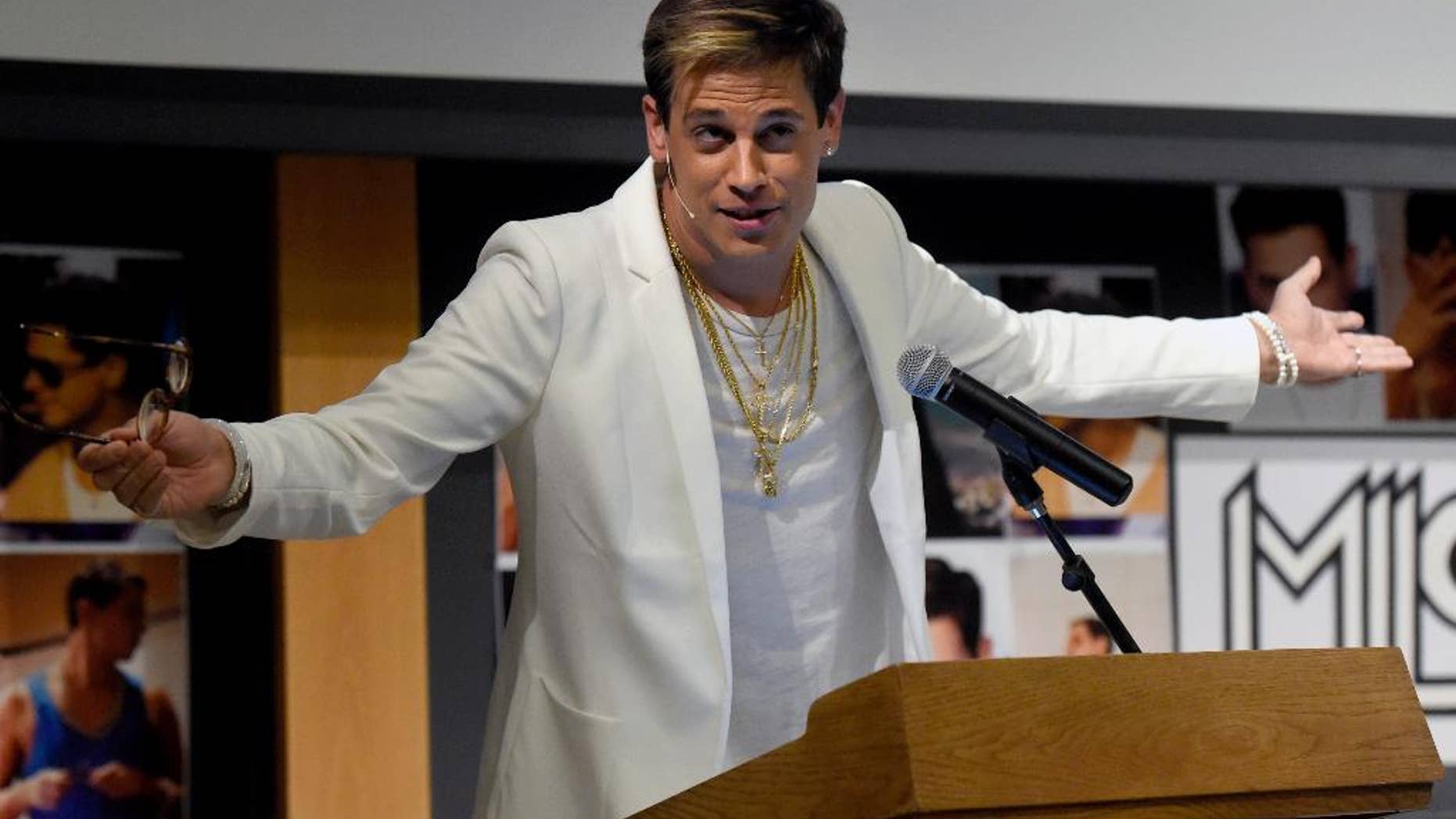 ILE - In this Jan. 25, 2017 file photo, Milo Yiannopoulos speaks on campus in the Mathematics building at the University of Colorado in Boulder, Colo. Yiannopoulos, the polarizing Breitbart News editor, has gained notoriety for railing against feminists, Muslims and political correctness. The next stop on his college speaking tour is UC Berkeley, where protests and outrage against the event have stirred a debate about freedom of speech and highlighted the sensitivities on college campuses at the dawn of the Trump presidency. (Jeremy Papasso/Daily Camera via AP, file)
