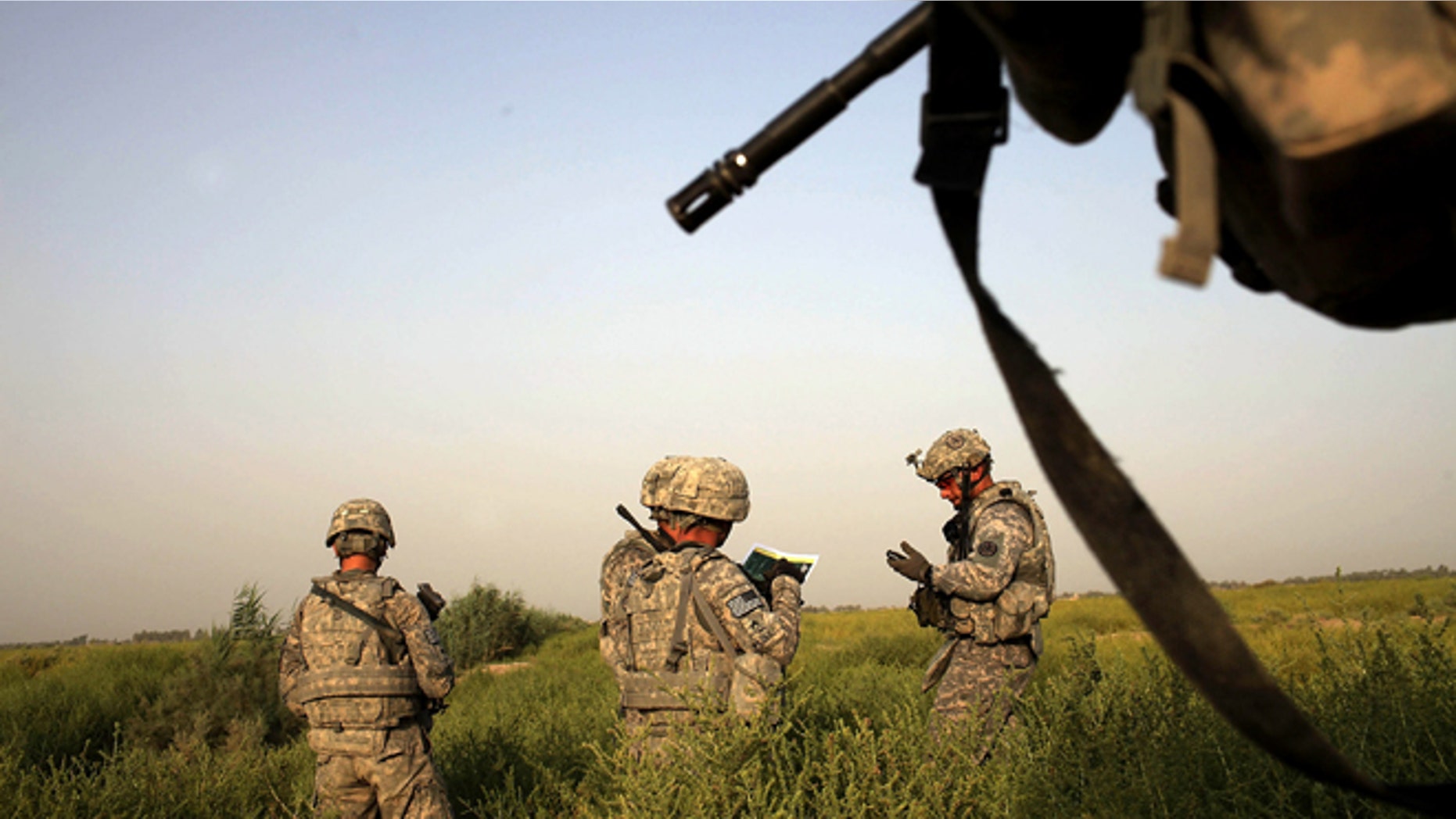 U.S. soldiers with the 3rd Armored Cavalry Regiment participate in a patrol on July 17, 2011 in Iskandariya, Babil Province, Iraq. (Photo by Spencer Platt/Getty Images)