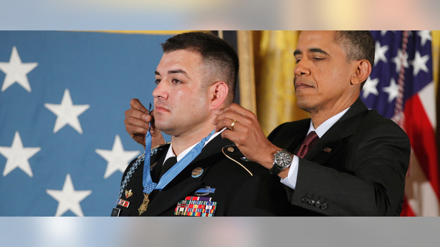 President Barack Obama awards US Army Sgt. First Class Leroy Arthur Petry, from Santa Fe, N.M., the Medal of Honor during a ceremony in the East Room of the White House in Washington.